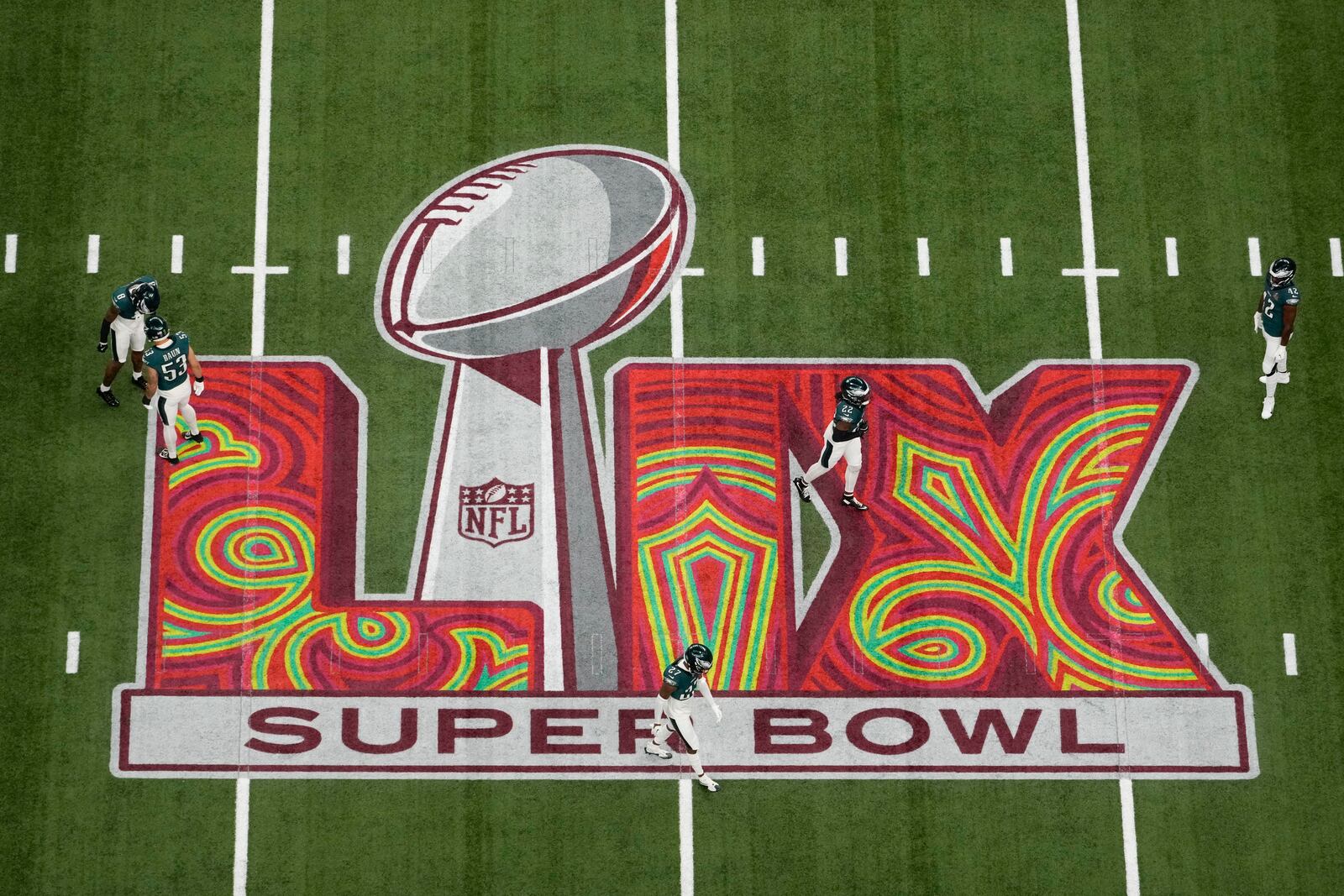 Philadelphia Eagles players warm up before the NFL Super Bowl 59 football game against the Kansas City Chiefs, Sunday, Feb. 9, 2025, in New Orleans. (AP Photo/Godofredo A. Vásquez)