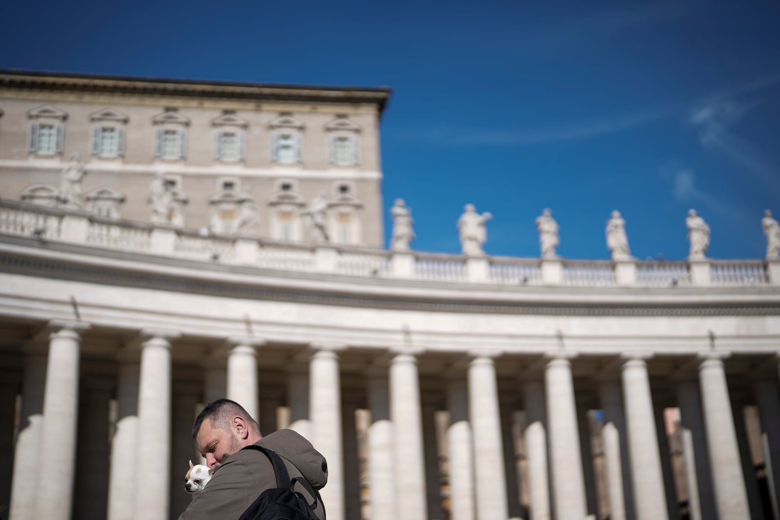 Faithful wait under the closed window of the Apostolic Palace at The Vatican, Sunday, Feb. 16, 2025, from where Pope Francis, who was hospitalised on Friday, blesses the faithful gathered in St. Peter's Square after the Angelus every Sunday. (AP Photo/Gregorio Borgia)