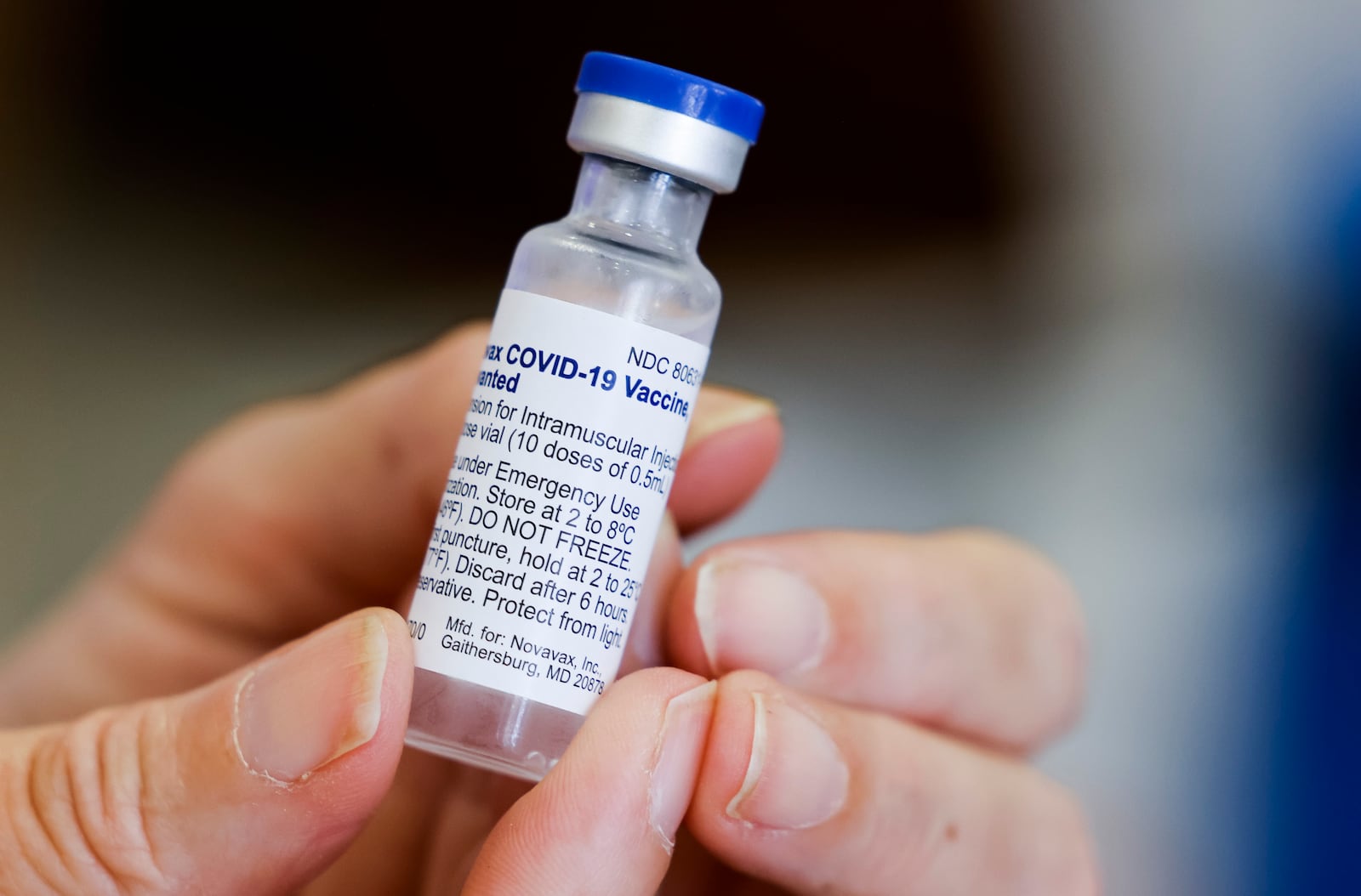 Kathryn Yang, Nursing Administrator for City of Hamilton Health Department, shows a vial of the new Novavax COVID-19 vaccine during a clinic at Hamilton city building Thursday, Sept. 1, 2022. NICK GRAHAM/STAFF NICK GRAHAM/STAFF