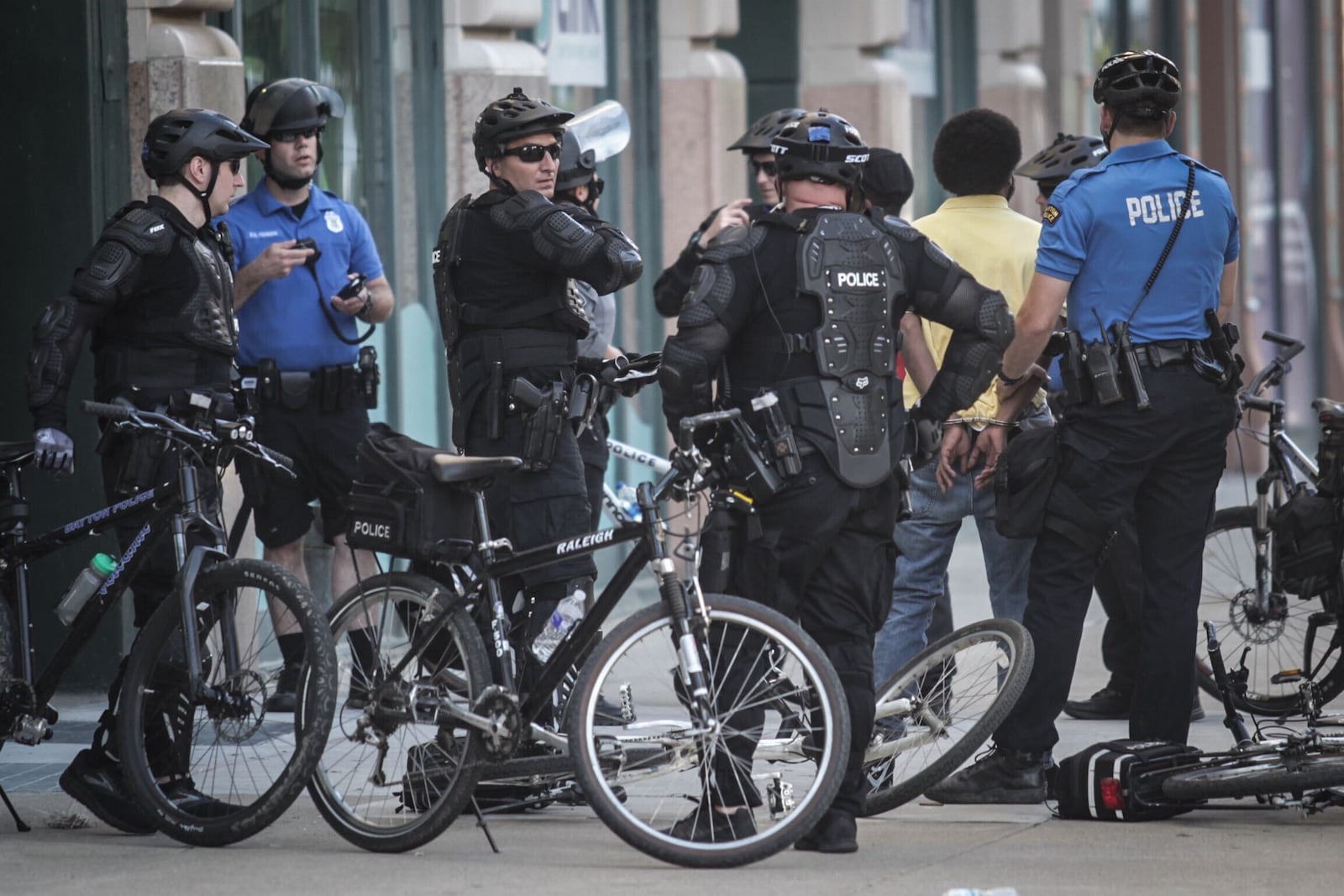 Dayton police arrested a man for a curfew violation at Third and Main streets Sunday evening, May 31, 2020, in downtown Dayton. JIM  NOELKER / STAFF