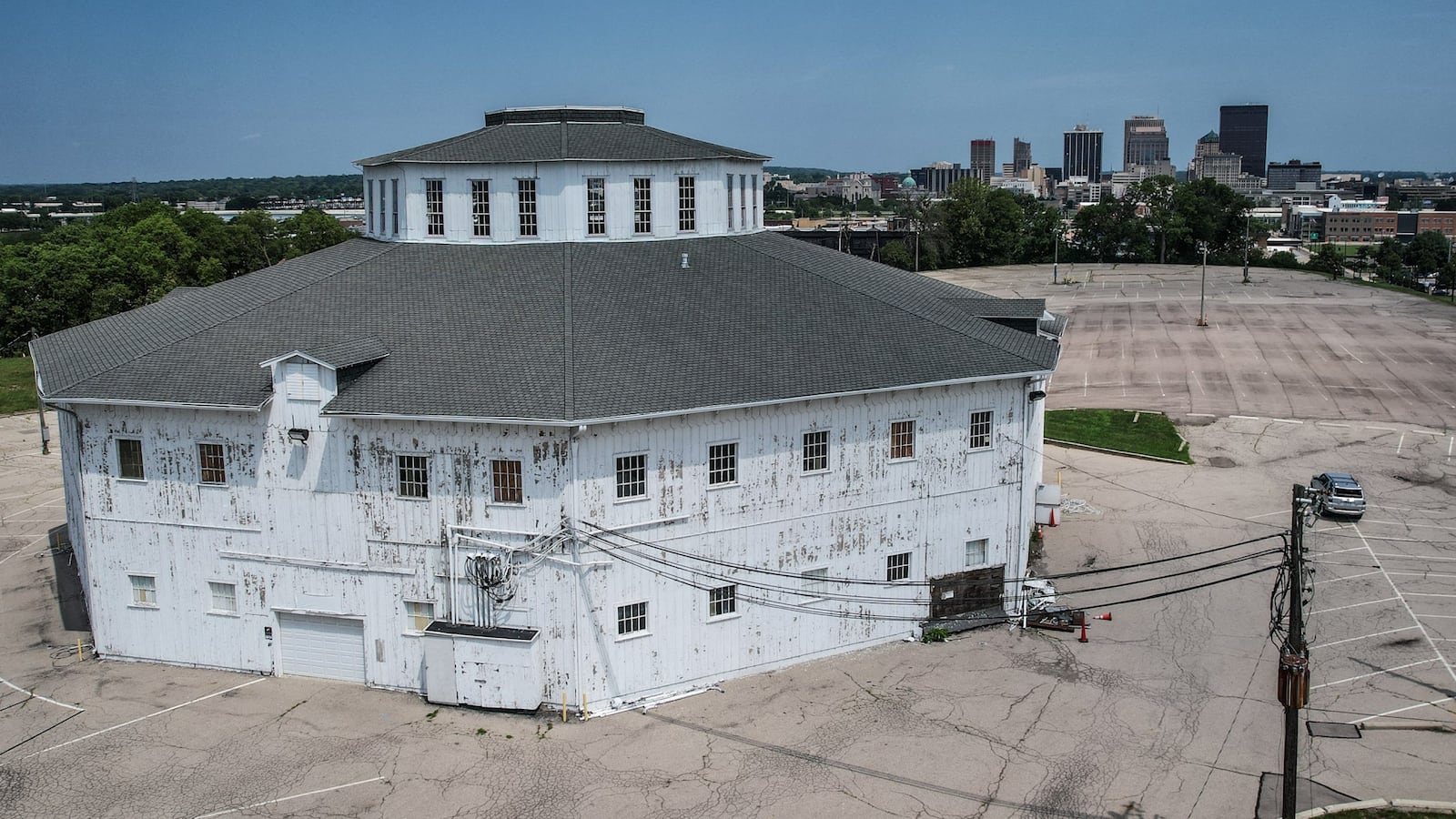 The Roundhouse at the old Montgomery County Fairgrounds sits on a hill across from Miami Valley Hospital. The city of Dayton is in the background. JIM NOELKER/STAFF