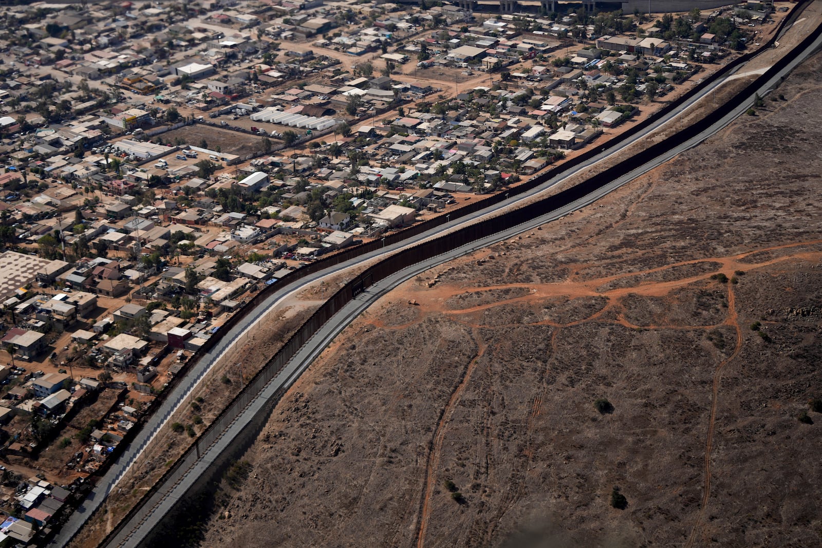 The U.S. Border with Mexico is seen in an aerial view Friday, Jan. 31, 2025, near San Diego. (AP Photo/Jae C. Hong)