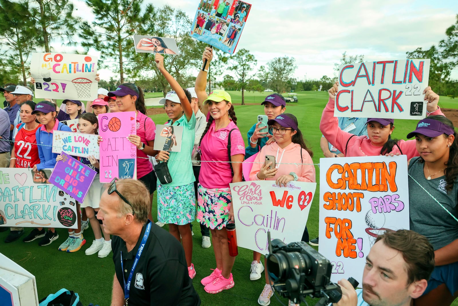 Fans of WNBA basketball player Caitlin Clark, of the Indiana Fever, congregate at the fourth tee during the pro-am at the LPGA Tour golf tournament, Wednesday, Nov 13, 2024, at the Pelican Golf Club in Belleair, Fla. (Douglas R. Clifford/Tampa Bay Times via AP)