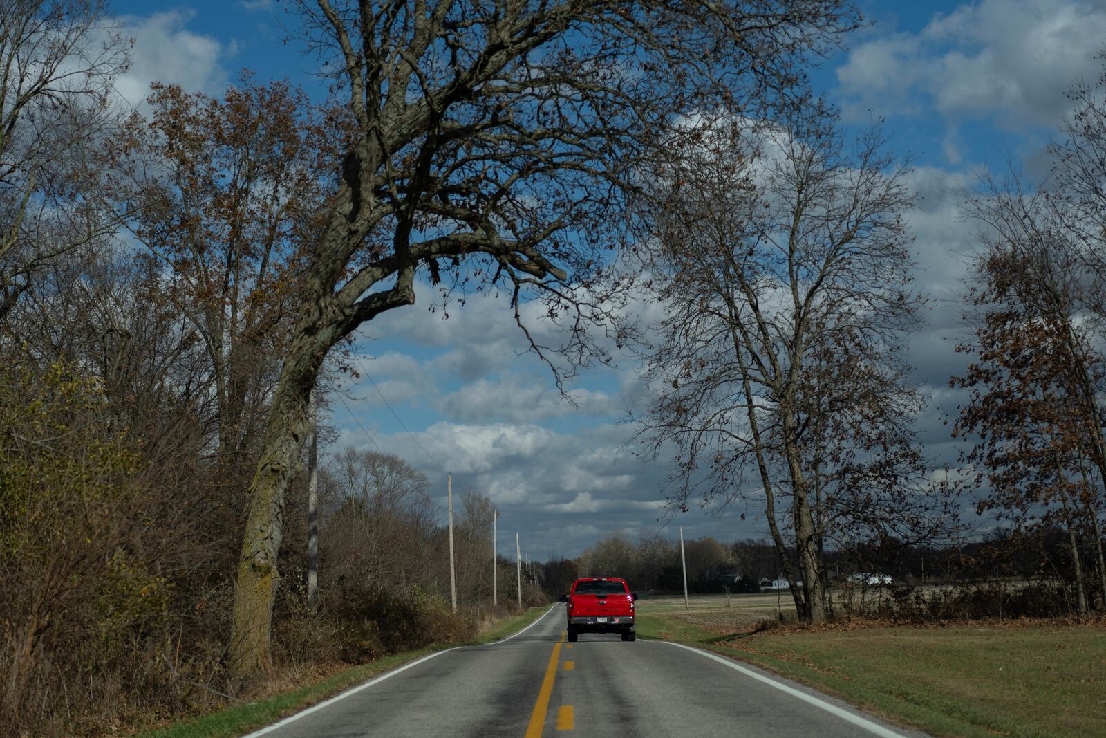 Erin and Mike Young drive to the Trenton Township building to vote with their adopted kids, Gianna, 7, Isaac, 5, and Lucas, 8, on Election Day, Tuesday, Nov. 5, 2024, in Sunbury, Ohio. (AP Photo/Carolyn Kaster)