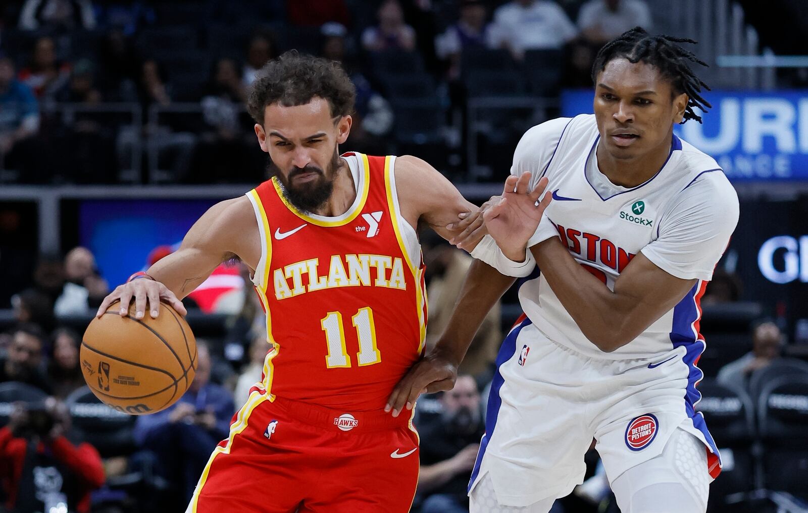 Atlanta Hawks guard Trae Young (11) drives against Detroit Pistons forward Ausar Thompson, right, during the first half of an NBA basketball game Monday, Feb. 3, 2025, in Detroit. (AP Photo/Duane Burleson)