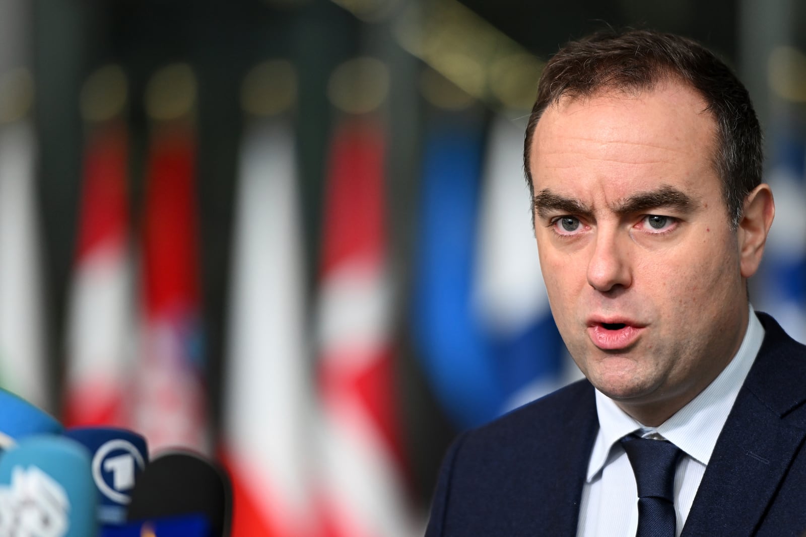 French Defense Minister Sebastien Lecornu speaks with the media as he arrives for a meeting of NATO defense ministers at NATO headquarters in Brussels, Thursday, Feb. 13, 2025. (AP Photo/Harry Nakos)