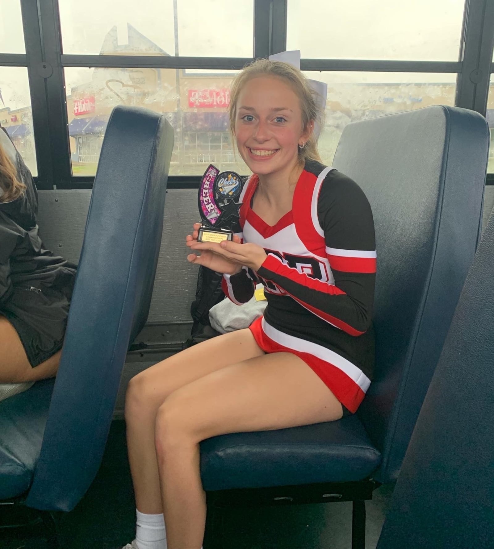 Tippecanoe High School's Ayeva Tilley with one of her jump winning trophies on bus ride home after a competition. CONTRIBUTED