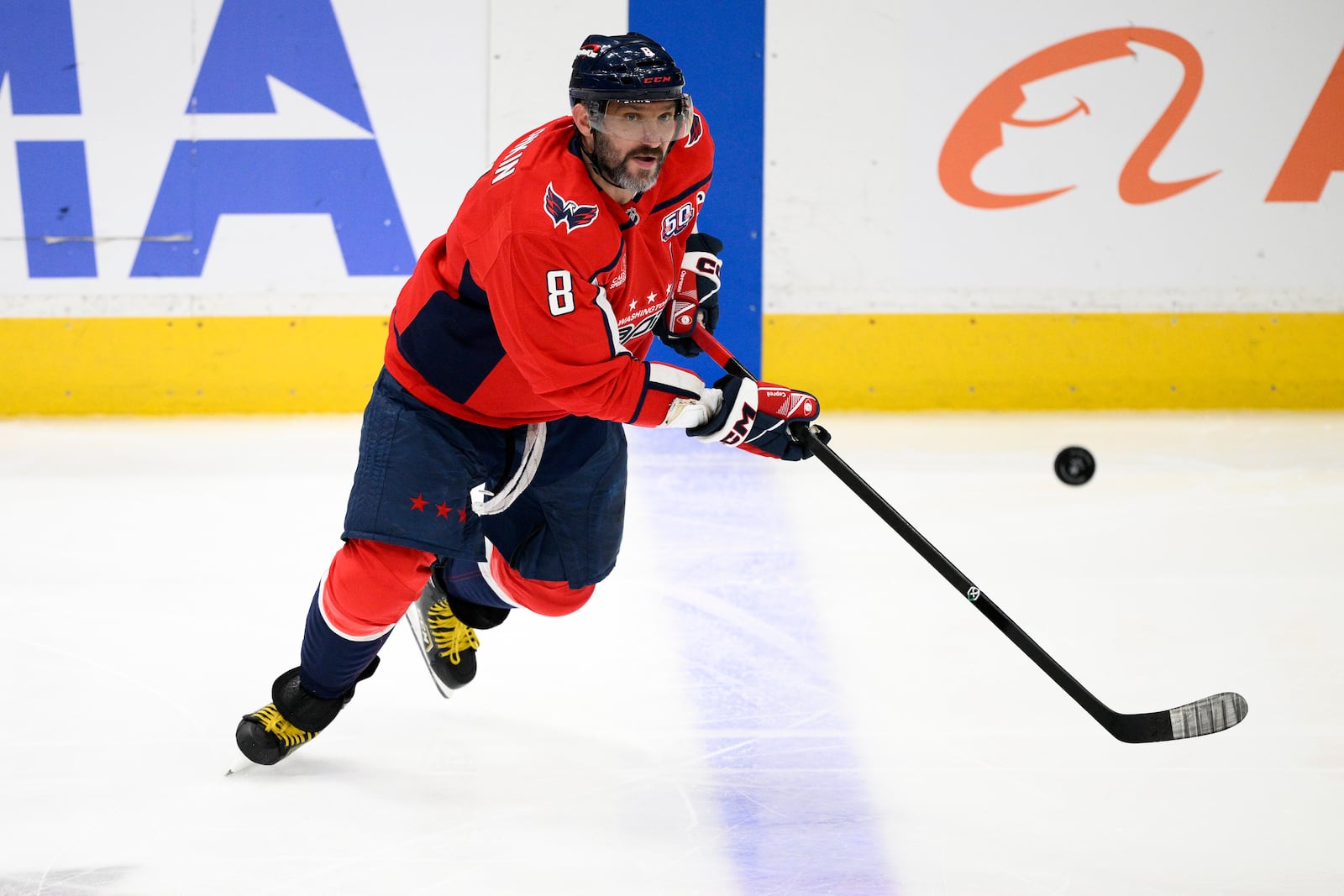 Washington Capitals left wing Alex Ovechkin chases the puck during the third period of an NHL hockey game against the Philadelphia Flyers, Thursday, March 20, 2025, in Washington. (AP Photo/Nick Wass)