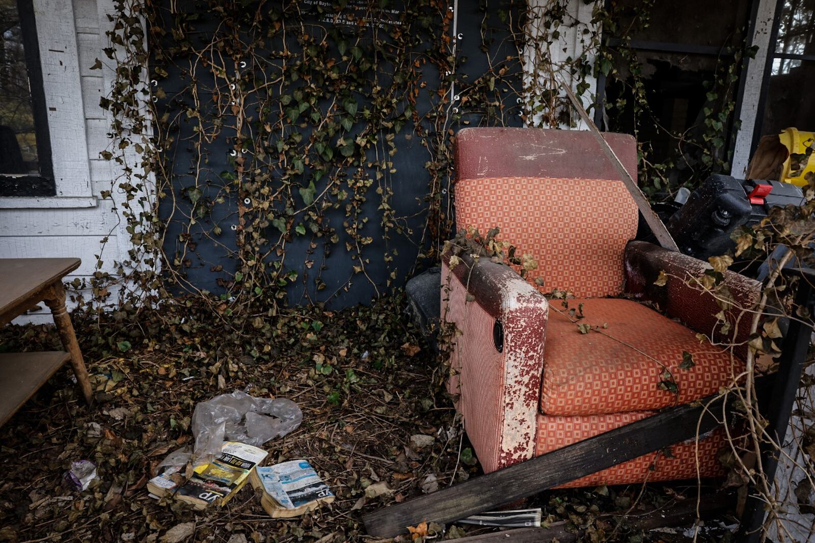 A chair on the porch of a residential property on the 500 block of Lexington Ave. in Dayton. The home is one of more than 1,300 on Dayton's nuisance list. JIM NOELKER/STAFF