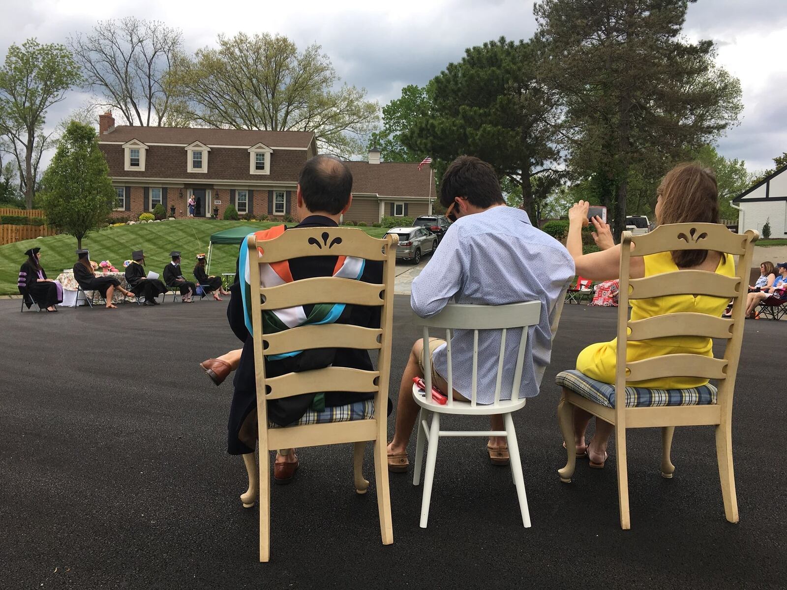 Neighbors of Southbridge Lane in Washington Twp. gathered for a graduation ceremony of 5 graduates who live on the street on Saturday, May 16, 2020. Staff Photo / Sarah Franks