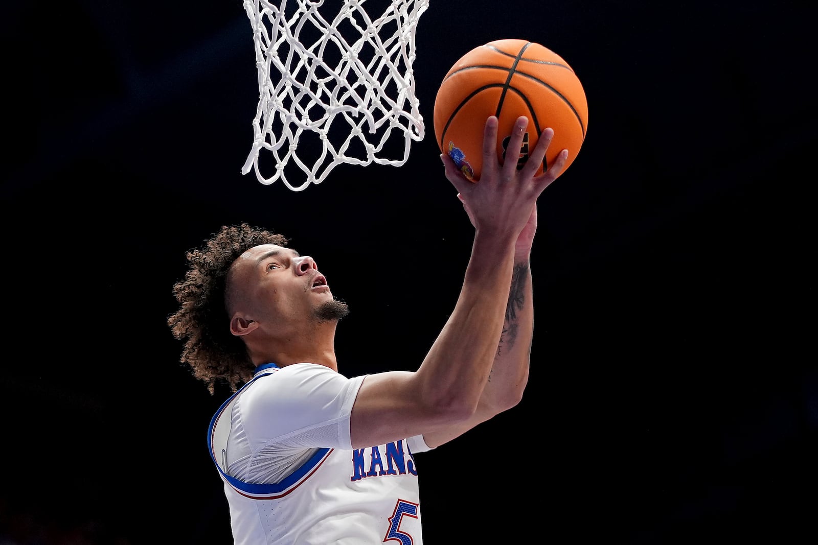 Kansas guard Zeke Mayo shoots during the first half of an NCAA college basketball game against UNC Wilmington Tuesday, Nov. 19, 2024, in Lawrence, Kan. (AP Photo/Charlie Riedel)