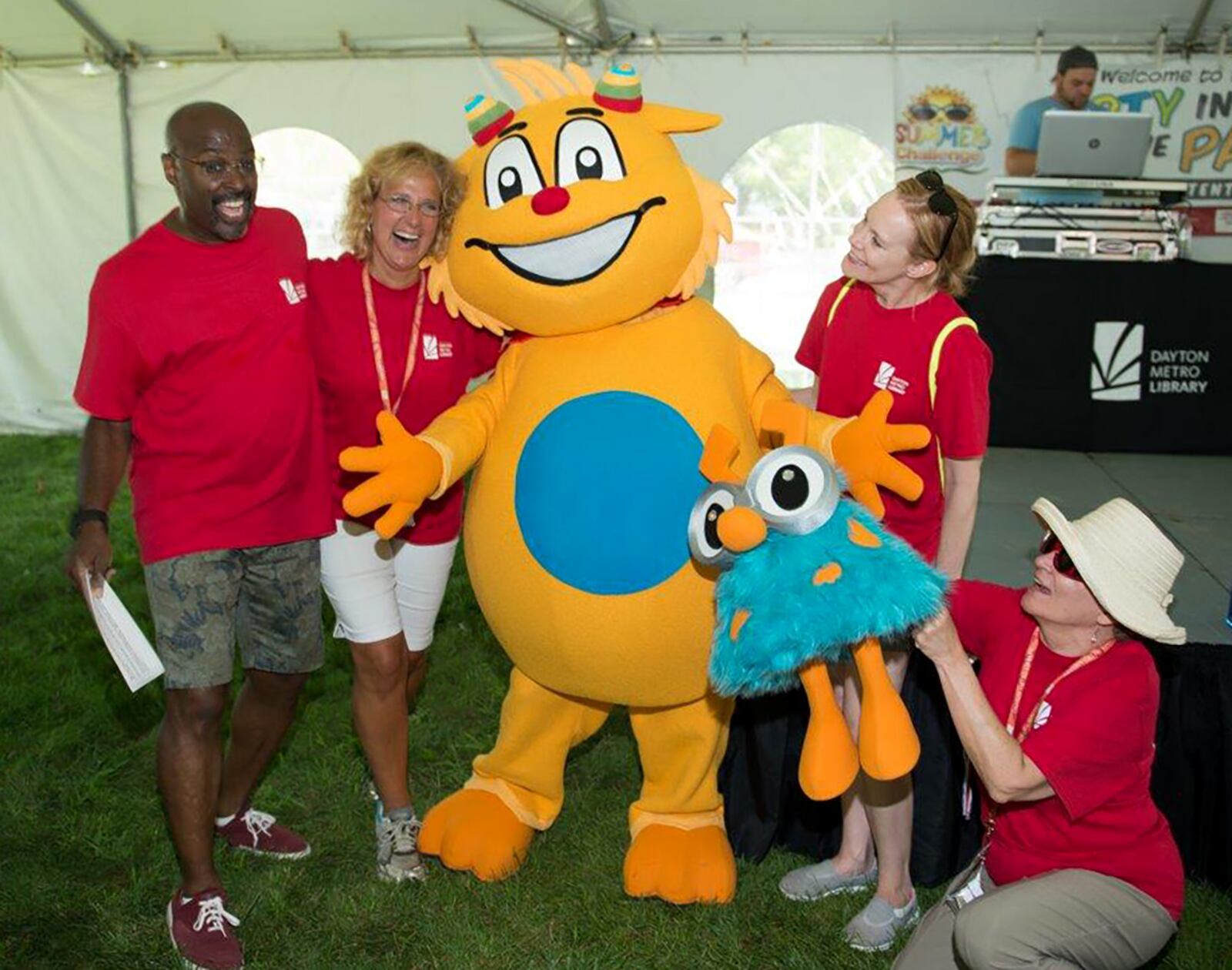 Diane Farell (second from left) with Cosmo and Pip, the Library's mascot and sidekick. CONTRIBUTED PHOTO