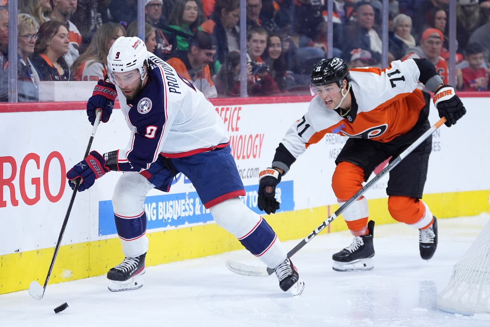 Columbus Blue Jackets' Ivan Provorov, left, tries to keep the puck away from Philadelphia Flyers' Tyson Foerster during the second period of an NHL hockey game, Saturday, Dec. 21, 2024, in Philadelphia. (AP Photo/Matt Slocum)