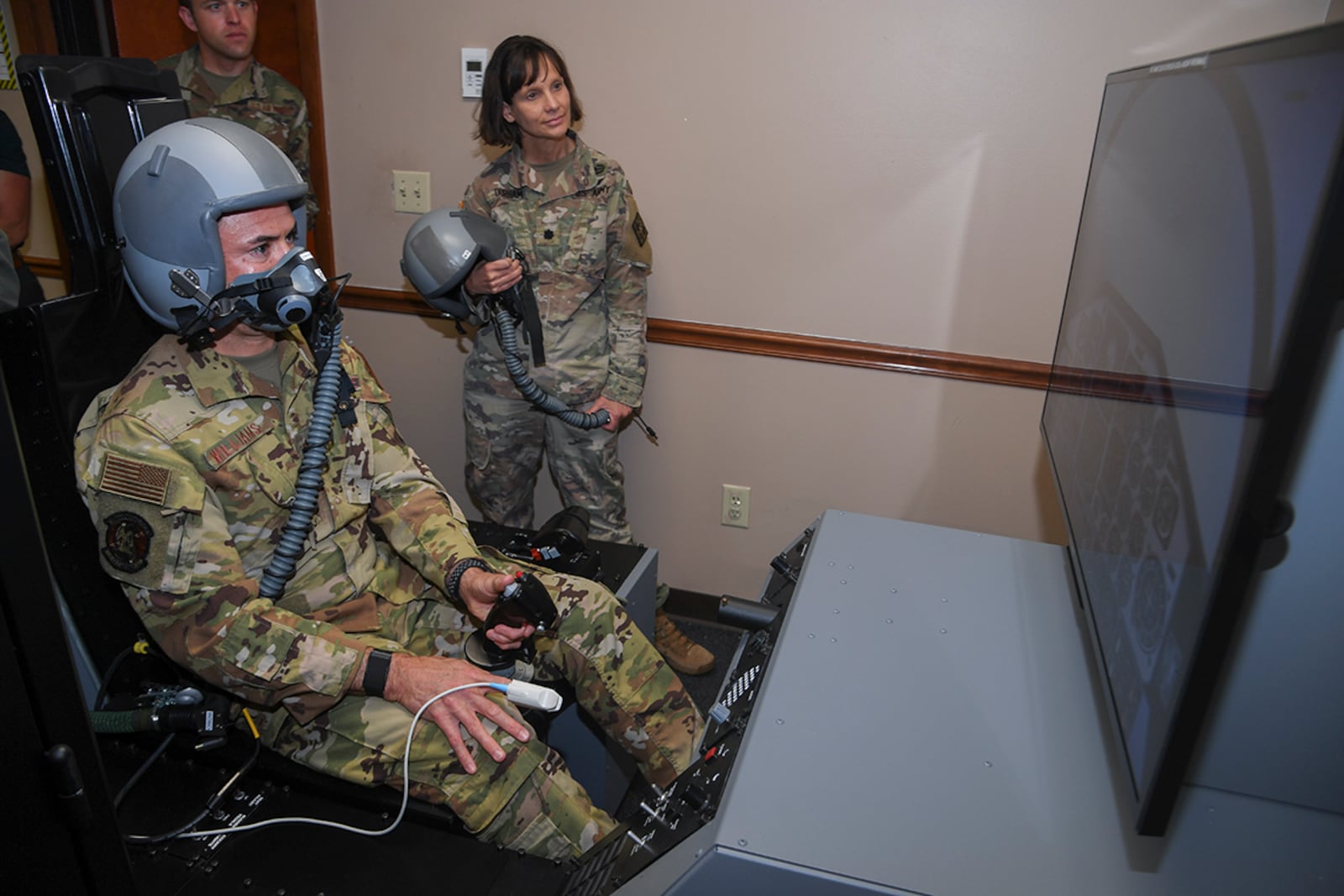 Maj. Owen John Williams flies a simulator that introduces hypoxia-like symptoms to orient users on its effects and learn how to recover at Columbus Air Force Base, Miss., on April 13. U.S. AIR FORCE PHOTO/KEITH WRIGHT