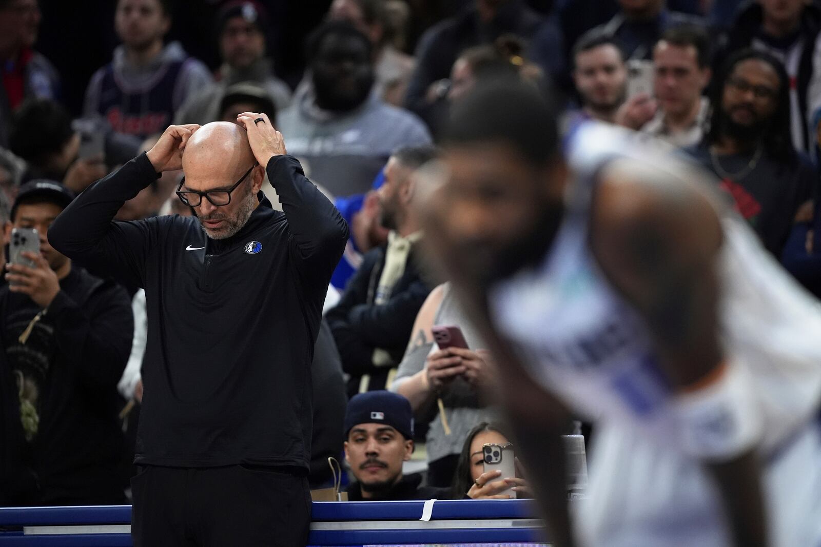 Dallas Mavericks' Jason Kidd, left, and Kyrie Irving react during the second half of an NBA basketball game against the Philadelphia 76ers, Tuesday, Feb. 4, 2025, in Philadelphia. (AP Photo/Matt Slocum)