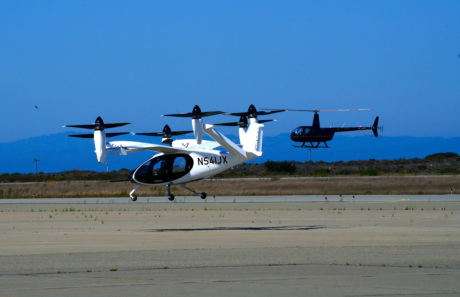 An "electric vertical take-off and landing" aircraft built by Joby Aviation lands at an airfield in Marina, Calif. on Monday, Oct. 7, 2024. (AP Photo/Terry Chea)