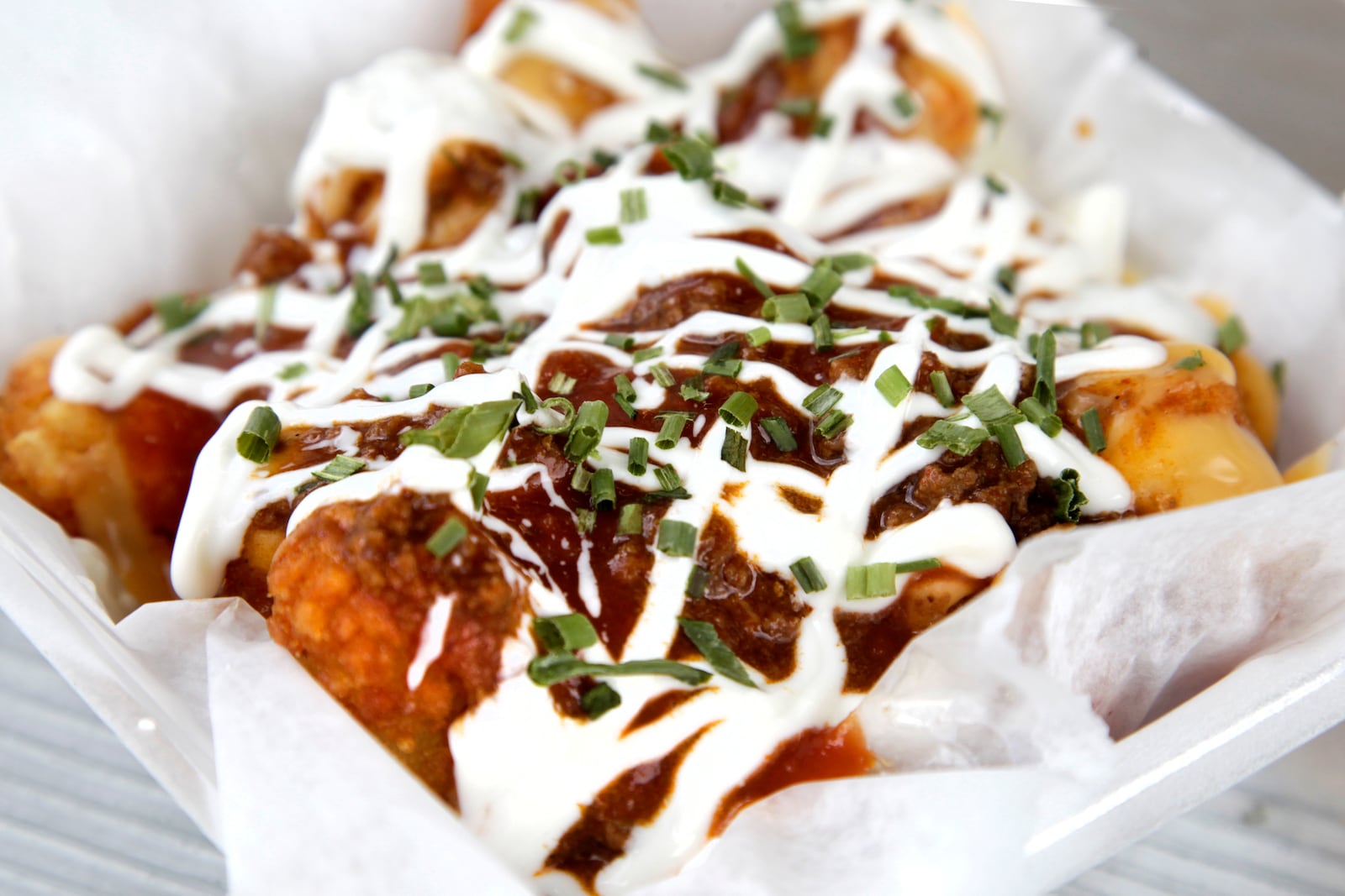 Tot-Chos at Underdogs Mobile are topped with seasoned beef, cheese, salsa, sour cream and green onion. LISA POWELL / STAFF