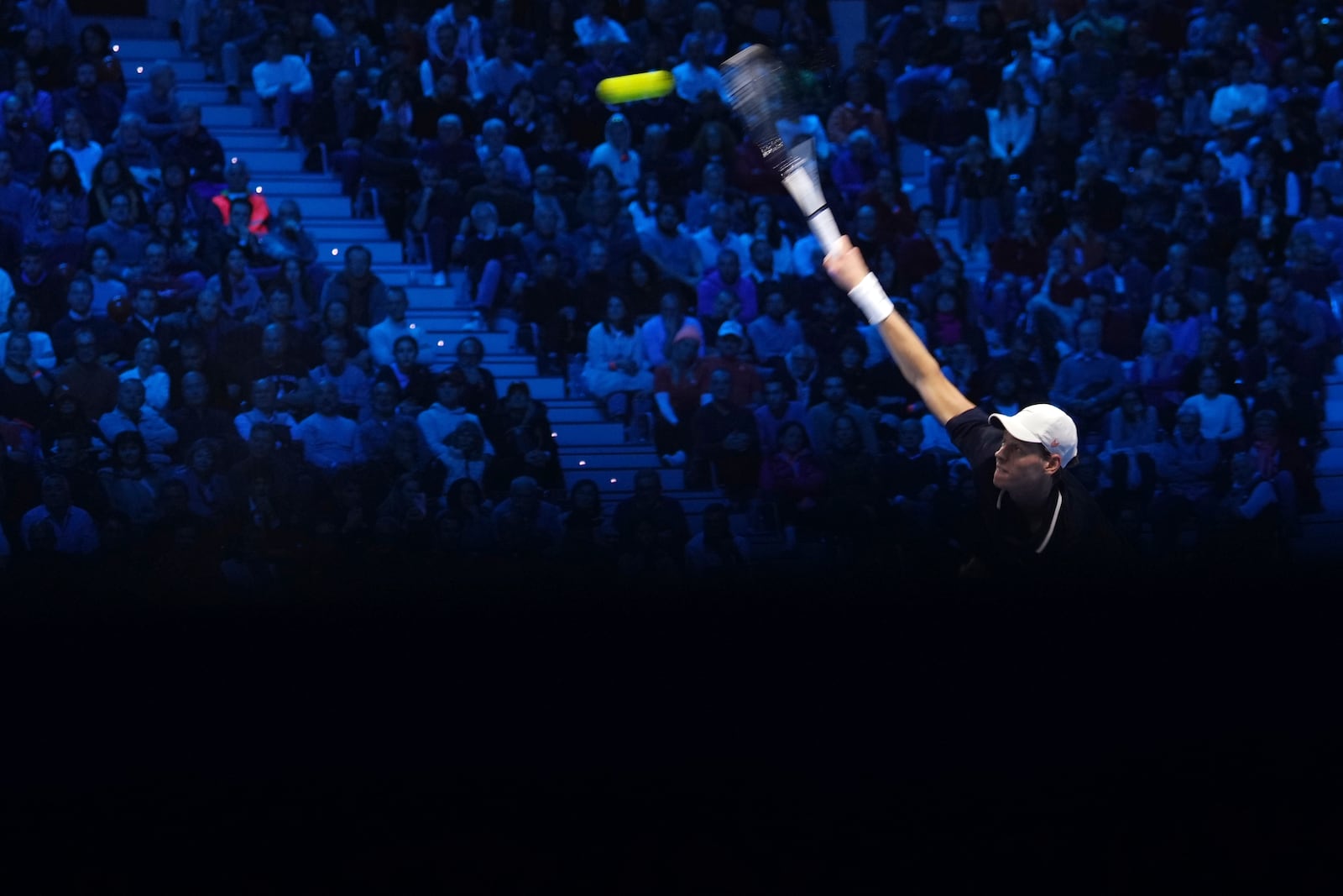 Italy's Jannik Sinner returns the ball to United States' Taylor Fritz during their singles tennis match of the ATP World Tour Finals at the Inalpi Arena, in Turin, Italy, Tuesday, Nov. 12, 2024. (AP Photo/Antonio Calanni)