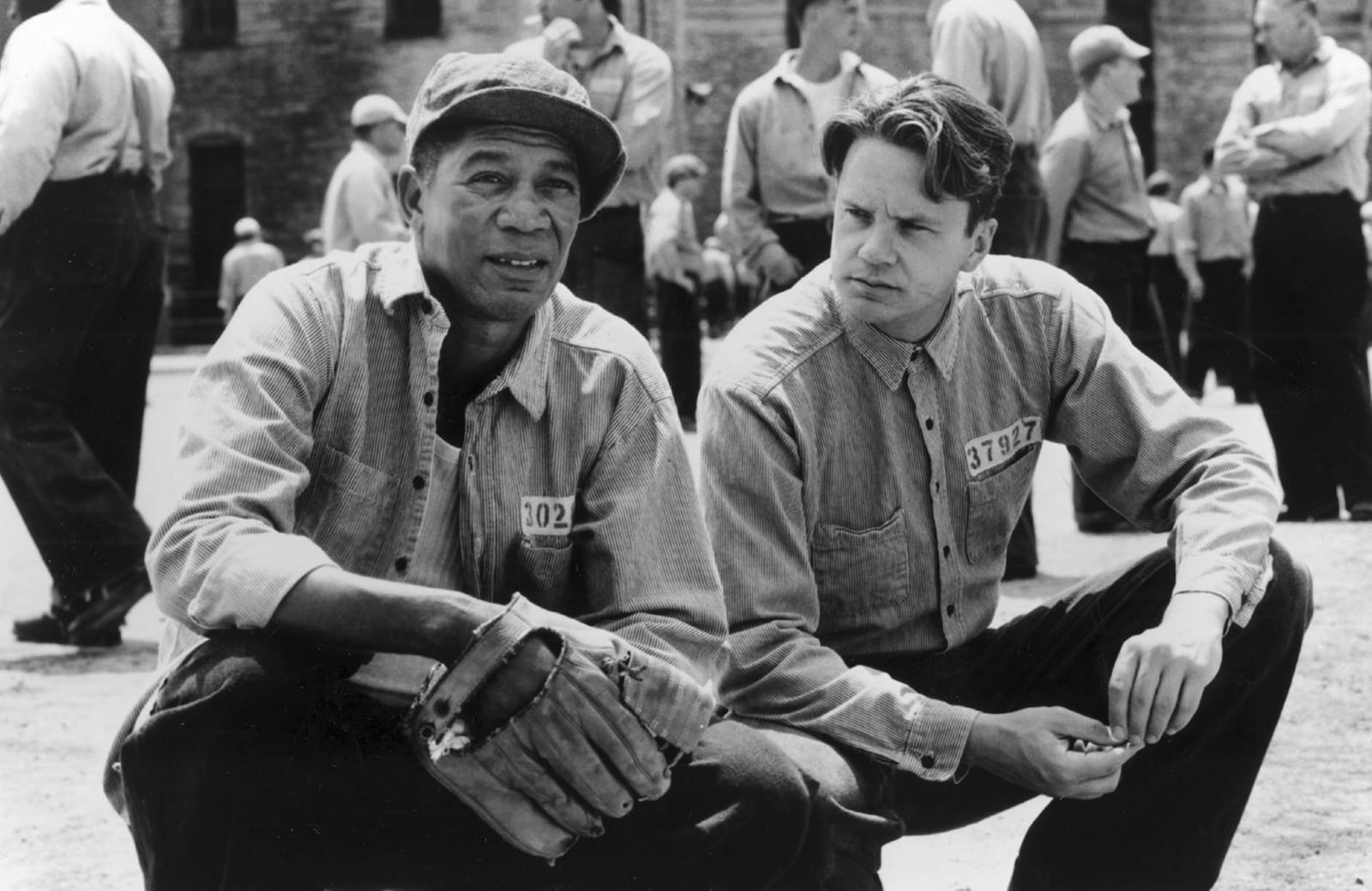 FILE - In this photo provided by Courtesy Castle Rock Entertainment via the Library of Congress, a scene from the movie Shawshank Redemption, featuring inmates Red (Morgan Freeman), left, and Andy (Tim Robbins) gather in the prison yard at Shawshank. (Courtesy Castle Rock Entertainment/Library of Congress via AP, File)