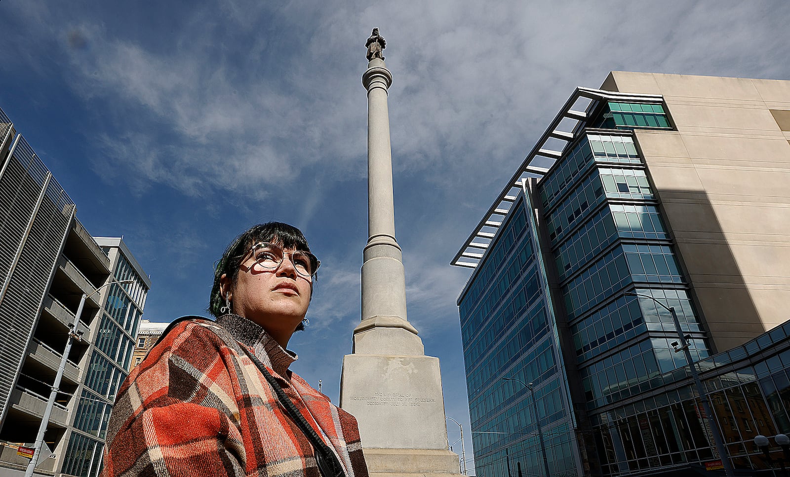 Carly Risenhoover-Peterson at the Civil War monument at Main and Monument in downtown Dayton. MARSHALL GORBY\STAFF