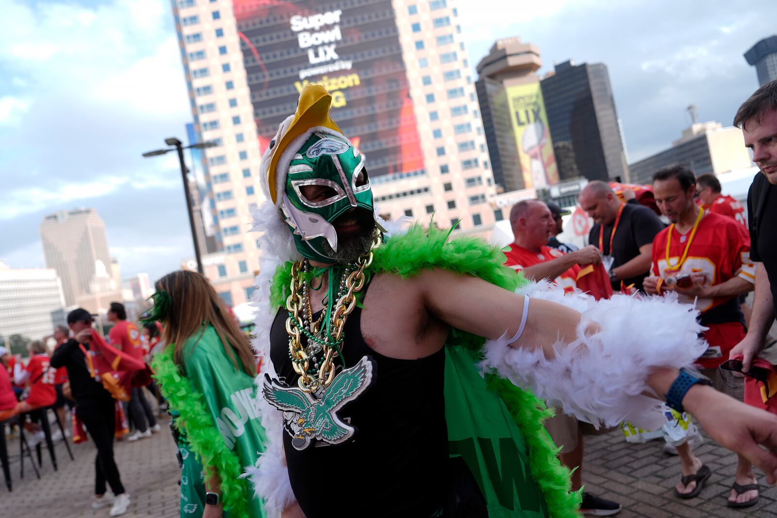 A Philadelphia Eagles fan walks near the Caesars Superdome before the NFL Super Bowl 59 football game between the Kansas City Chiefs and the Eagles, Sunday, Feb. 9, 2025, in New Orleans. (AP Photo/Julia Demaree Nikhinson)