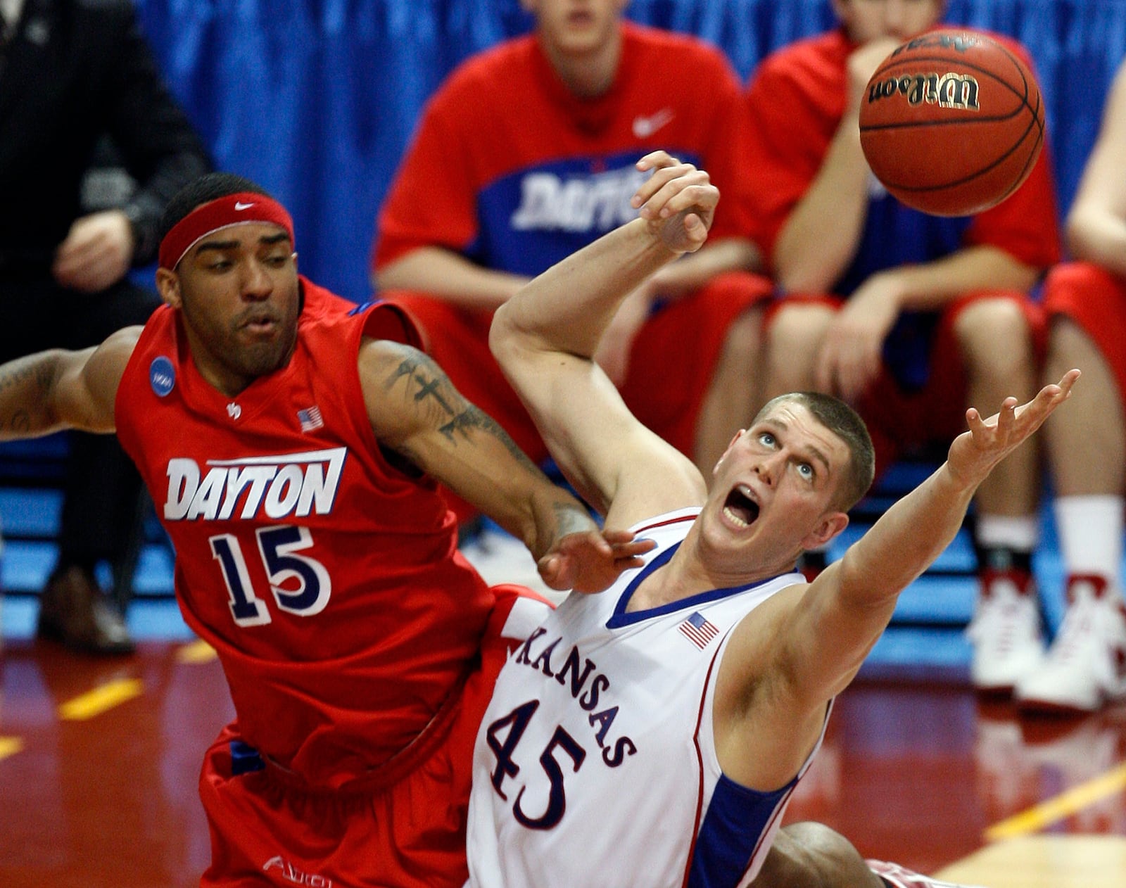 Kansas' Cole Aldrich (45) and Dayton's Charles Little (15) look for a rebound during the second half of a second-round men's NCAA college basketball tournament game Sunday, March 22, 2009, in Minneapolis. (AP Photo/Ann Heisenfelt)