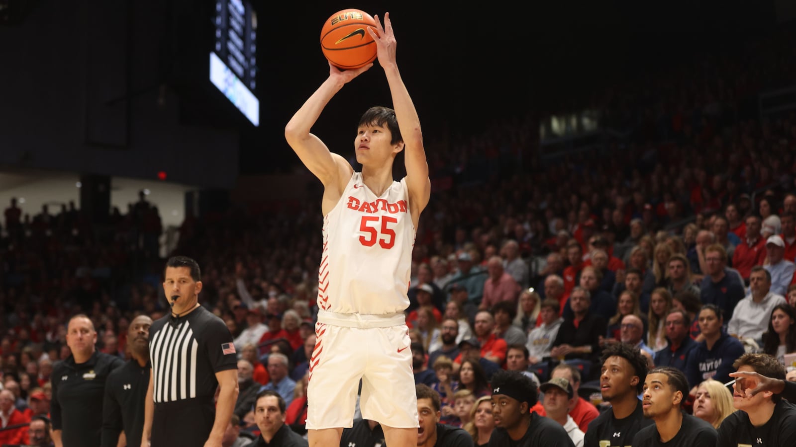 Dayton's Mike Sharavjamts makes a 3-pointer on Dayton's first possession of the season against Lindenwood on Monday, Nov. 7, 2022, at UD Arena. David Jablonski/Staff