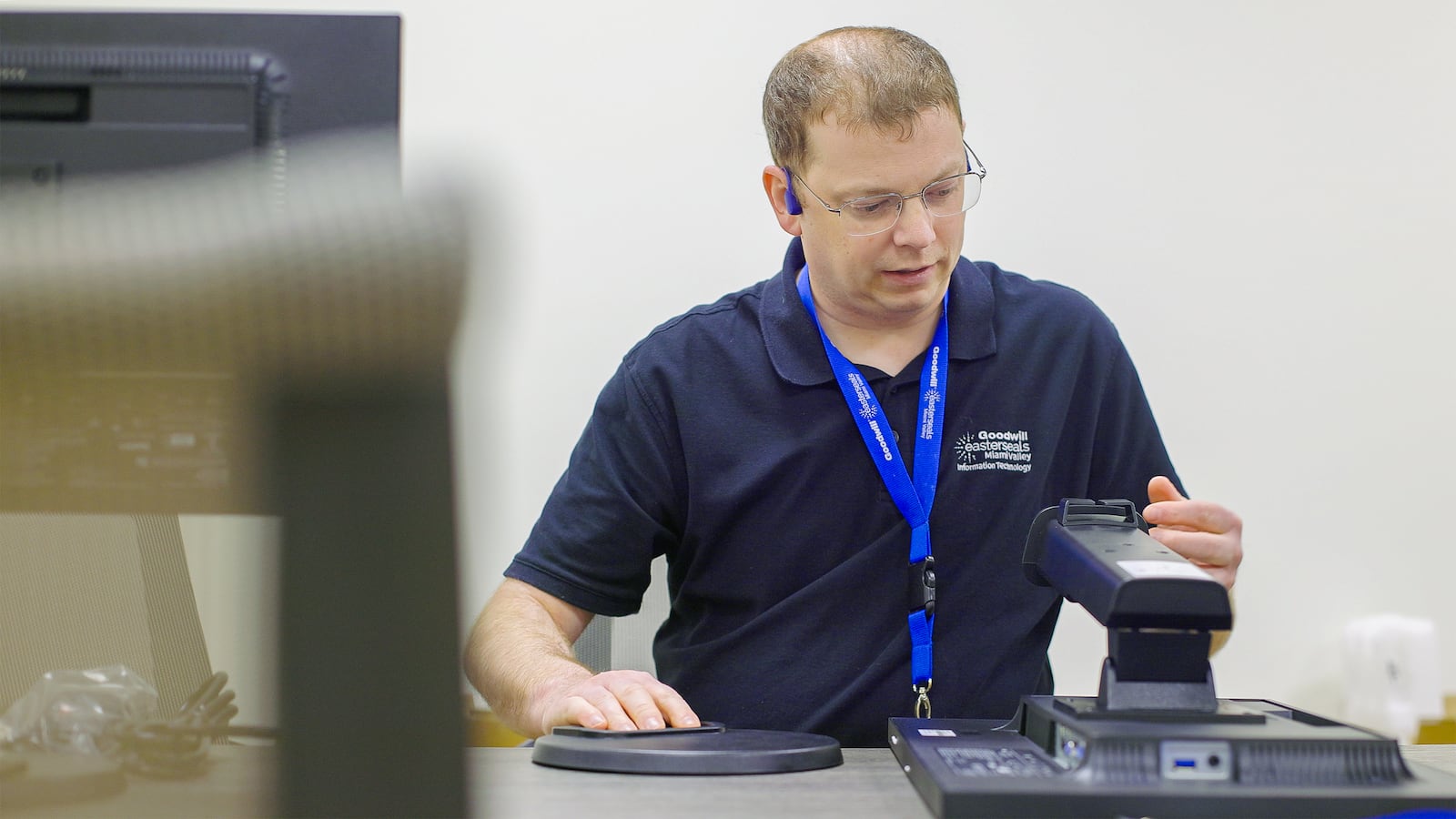 Rizer at work at Goodwill Easter Seals in Dayton. He started his job in 2019 and has moved up within the company to work at the corporate level.