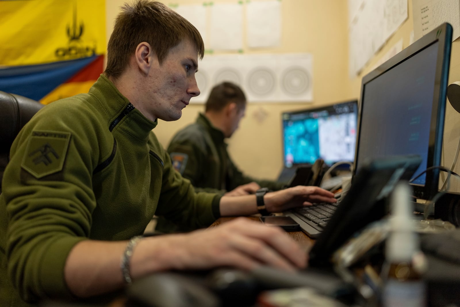 Ukrainian servicemen of Khartia brigade check the drone aerial view in the command centre Kharkiv region, Ukraine, Wednesday, March 12, 2025. (AP Photo/Alex Babenko)