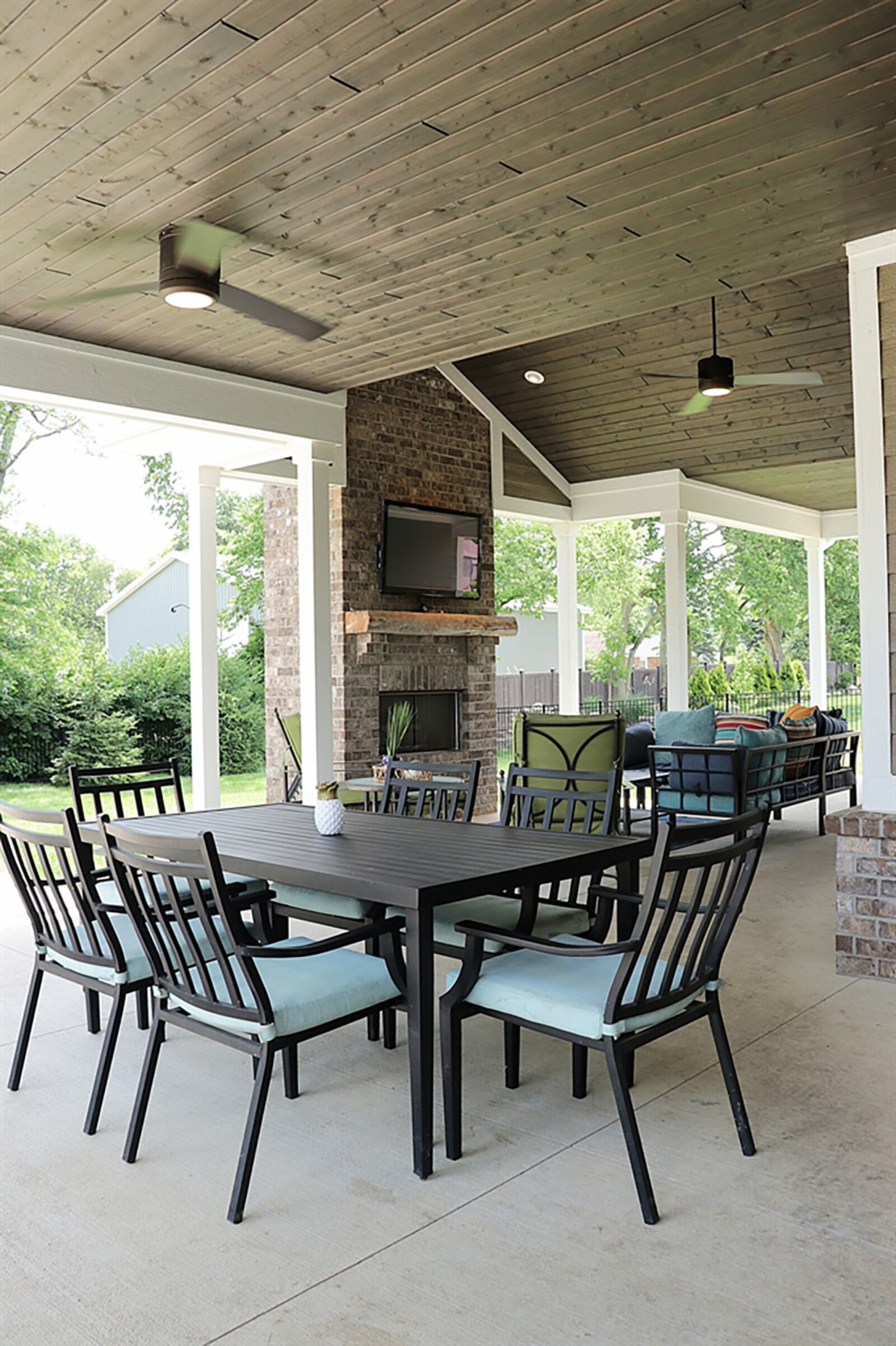 The 935-sq.-ft., covered veranda has a stone, gas fireplace, media hook-ups, ceiling paddle fans with lights and wood ceiling. CONTRIBUTED PHOTO BY KATHY TYLER