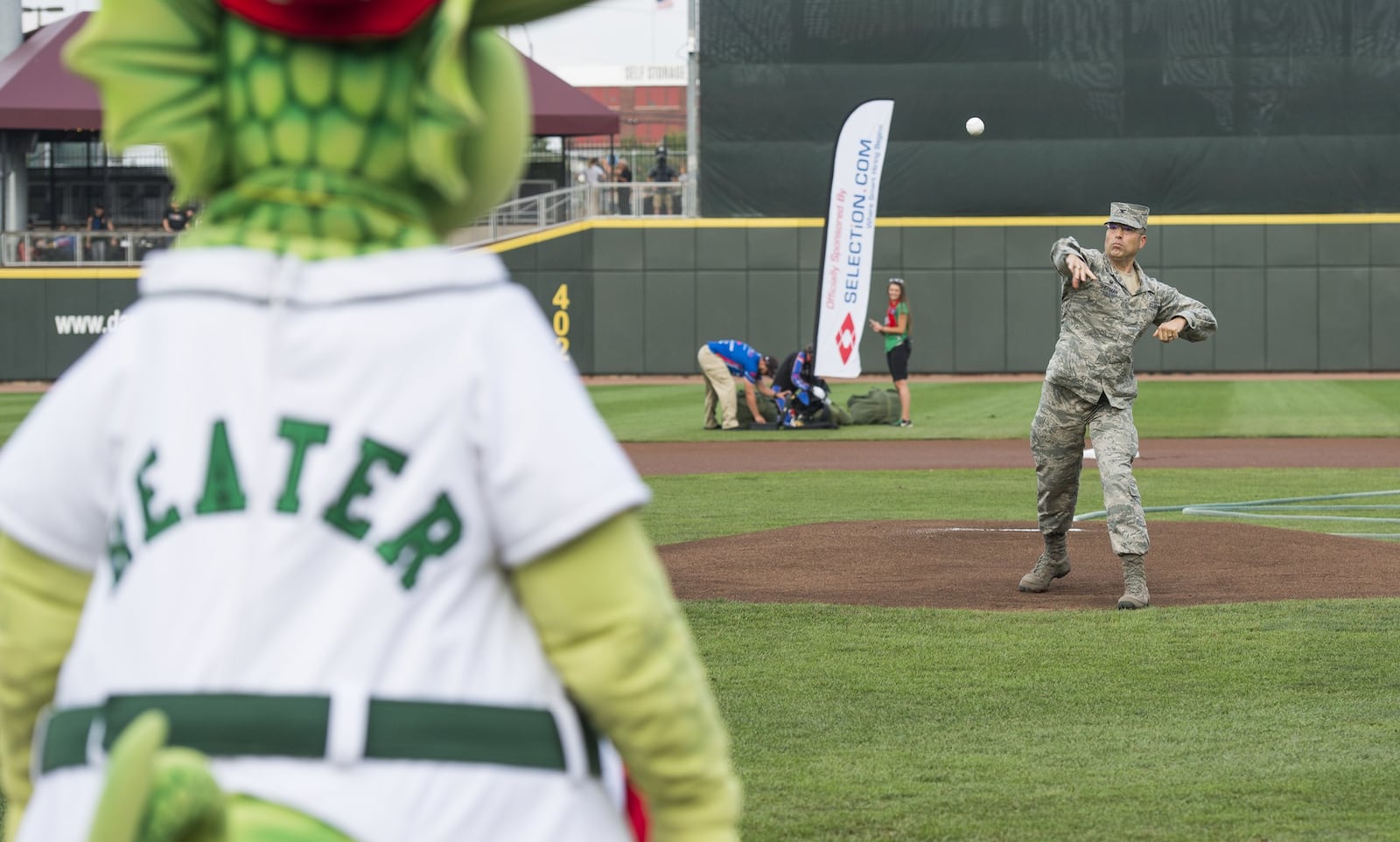 Col. Thomas Sherman, 88th Air Base Wing commander, throws out the ceremonial first pitch during the Hometown Heroes with the Dayton Dragons at Fifth Third Field in downtown Dayton, Aug. 18, 2018. In addition to throwing out the pitch, 31 individuals took the oath of enlistment to delayed enlistment personnel during the game. (U.S. Air Force photo/ Wesley Farnsworth)