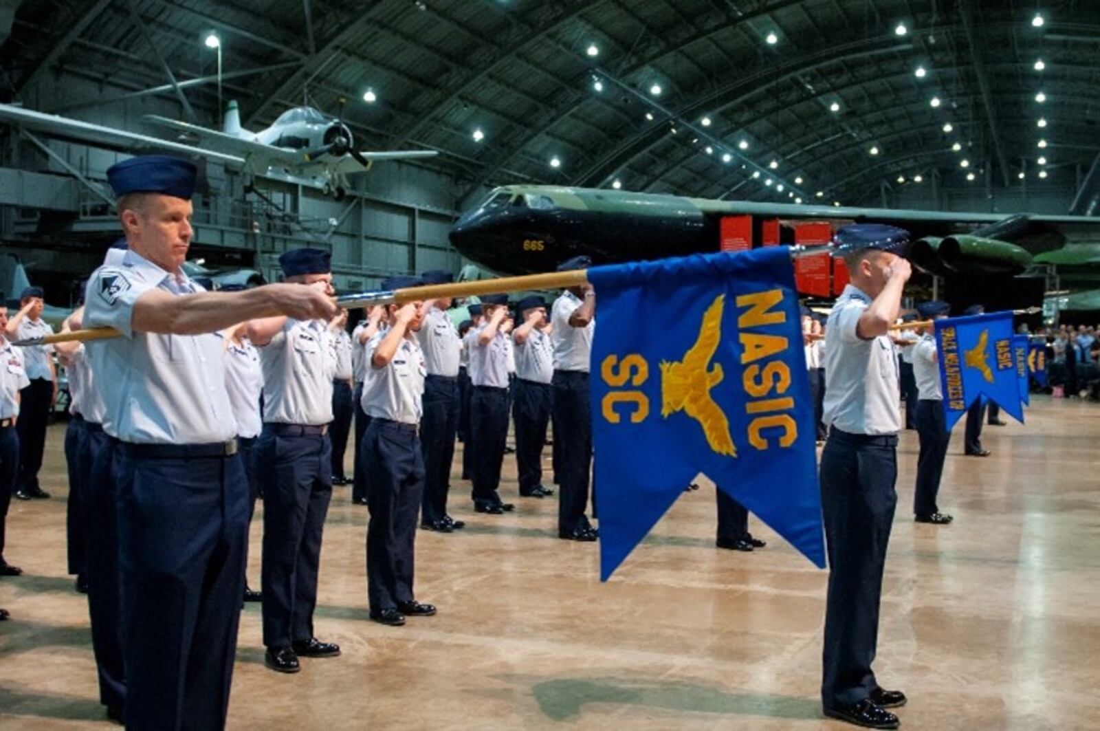 Members of the National Air and Space Intelligence Center stand render their first salute to Col. Ariel G. Batungbacal, who now leads the Air Force’s primary source for foreign air and space intelligence.  U.S. Air Force photo  / Staff Sgt. Samuel Earick