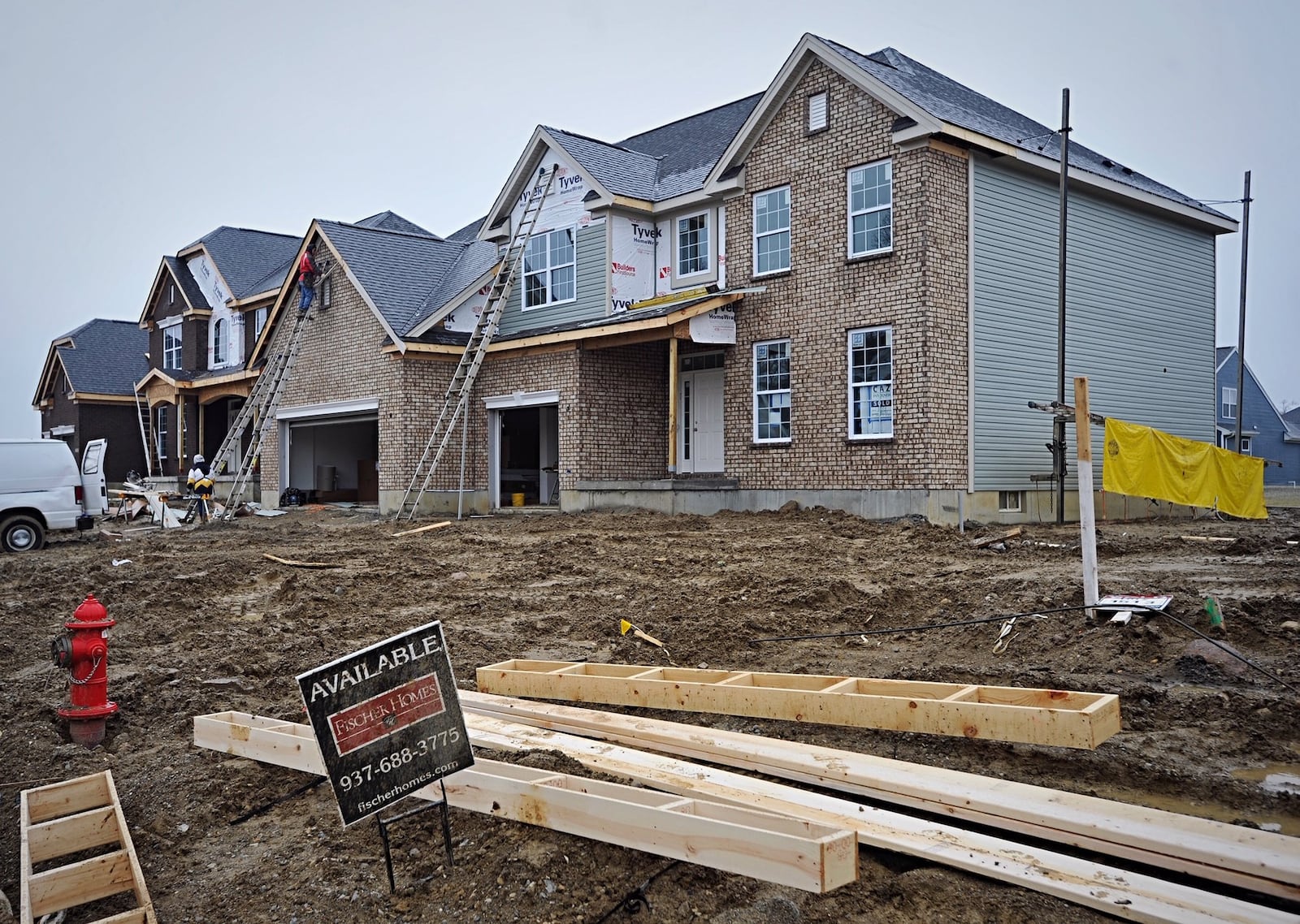 These houses on Linden Silver Dr. are some of 132 being built in the Carriage Trails subdivision in Huber Heights. STAFF/MARSHALL GORBY