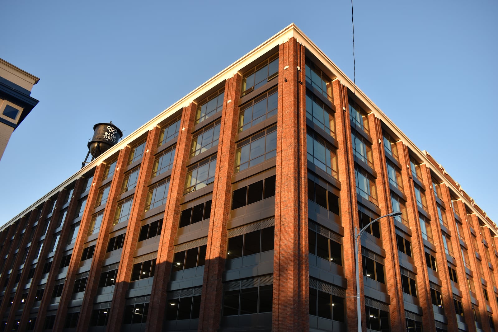 The former Mendelsons liquidation outlet building is being transformed into a mix of new uses, including residential, commercial and office spaces. The building at 340 E. First St. has been renamed the Delco. CORNELIUS FROLIK / STAFF