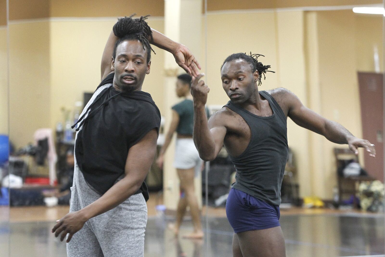 Devin Baker (left) and Michael Green rehearse a dance choreographed by Kevin Ward entitled “And Each Dayton You Mean More To Me.” The Dayton Contemporary Dance Company is celebrating its 50th year with a Golden Anniversary Gala on May 4 at the Schuster Center. LISA POWELL / STAFF