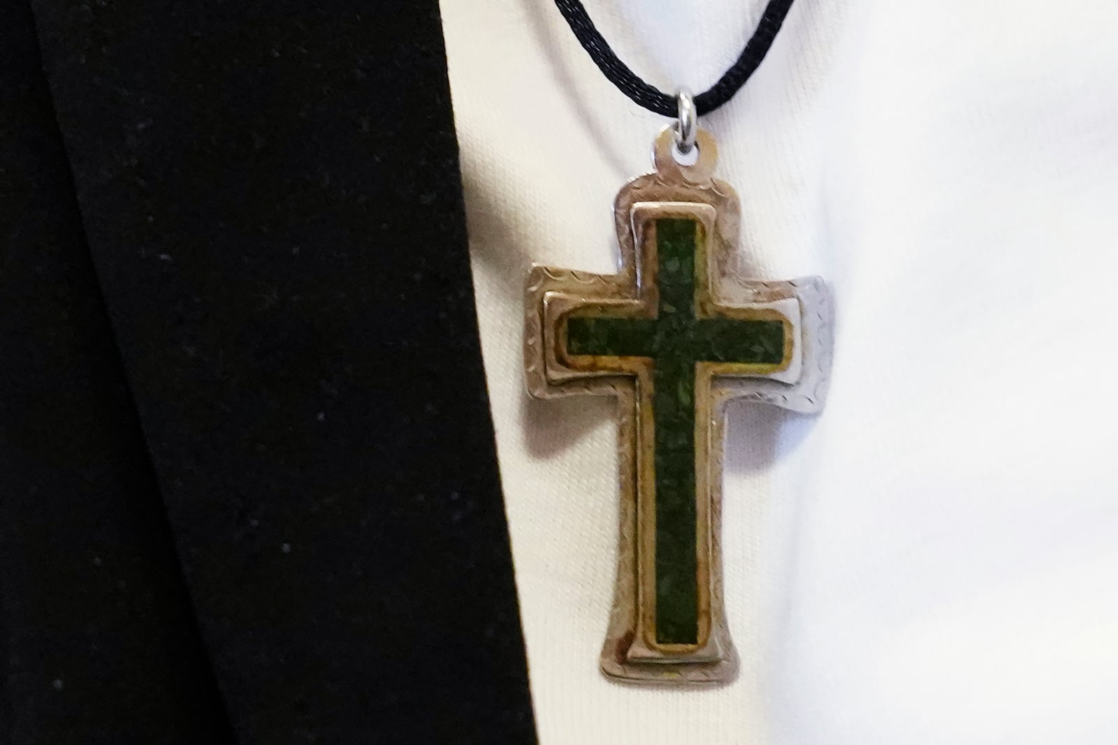 Cross necklace is seen on Sister Helen Prejean during a book club at Department Of Corrections Division 11 in Chicago, Monday, April 22, 2024. DePaul students and detainees are currently reading Dead Man Walking and the author, anti death penalty advocate, Sister Helen Prejean attended to lead a discussion. (AP Photo/Nam Y. Huh)