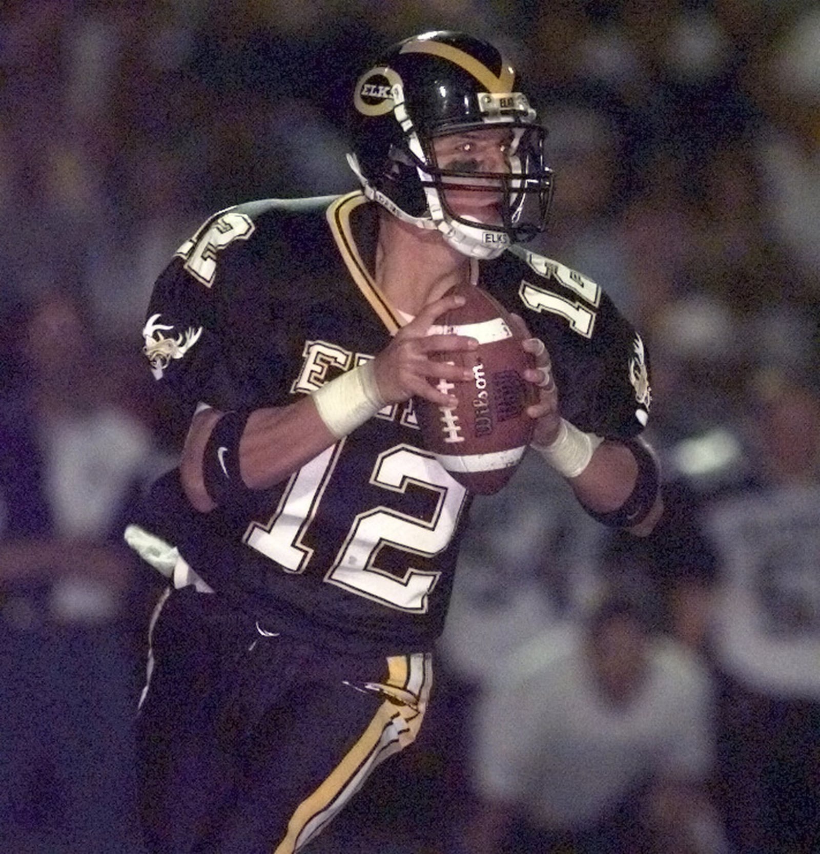 Centerville quarterback Ryan Hawk (12) prepares to make a pass during the third quarter of the match against Middletown H.S. on September 11, 1998. (William P. Cannon/Dayton Daily News)