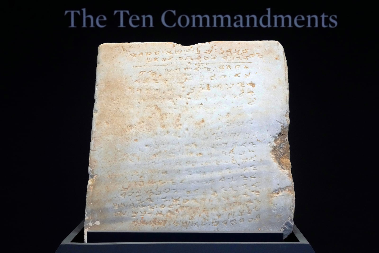 The oldest complete tablet of the Ten Commandments, weighing 115-pounds and approximately 1,500 years old, is displayed at Sotheby's, in New York, Monday, Dec. 9, 2024, where it is to be offered for auction in a single lot sale, Dec, 18, 2024. (AP Photo/Richard Drew)