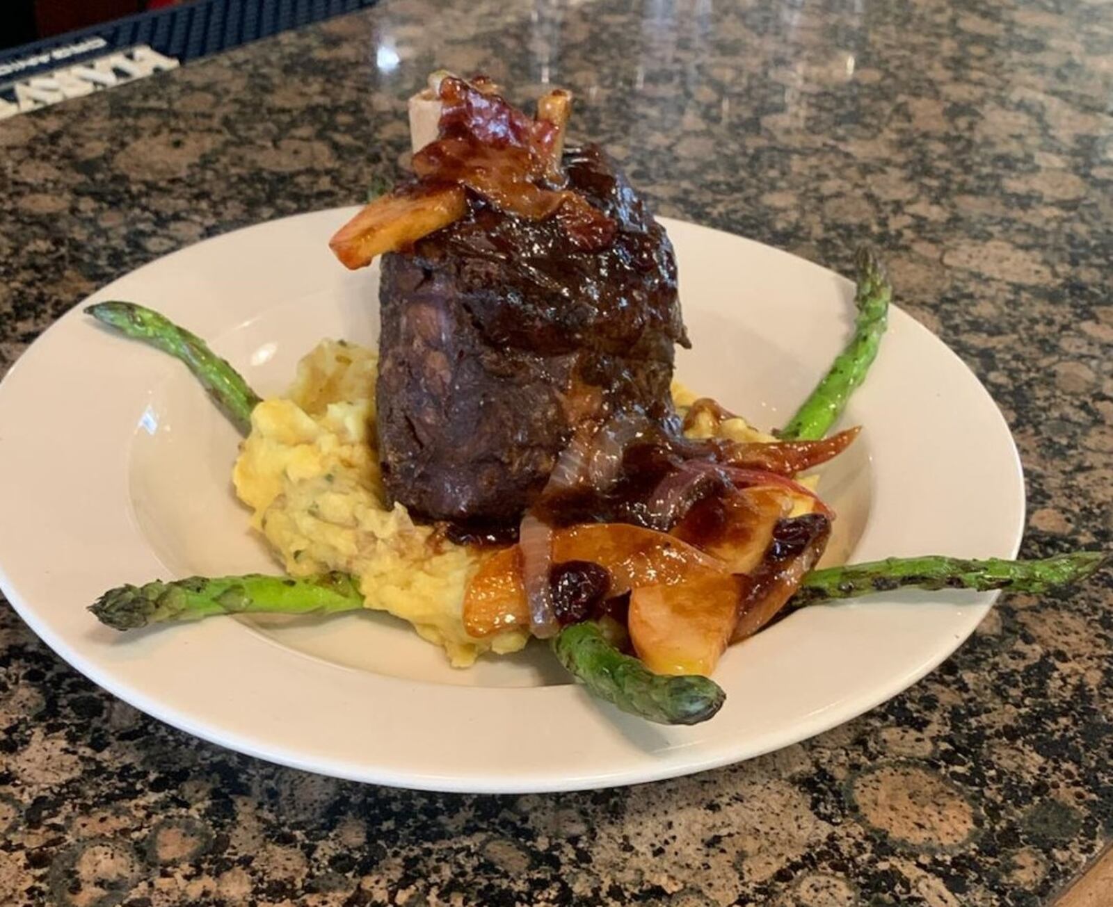 The Amber Rose will offer a Bacon Week special of Apple-wood Bacon Pork Shank, $24. The pork shank comes topped with  Apple-wood Bacon, Cranberry and Apple Chutney served over cheesy smashed potatoes with grilled asparagus. CONTRIBUTED