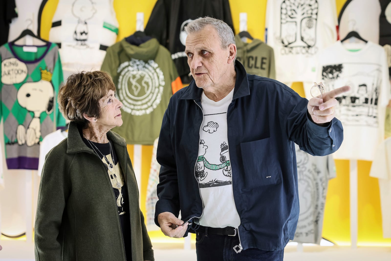 Jeannie Schulz, widow of Charles M. Schulz, talks with French fashion designer Jean-Charles de Castelbajac at the Snoopy In Style exhibition that runs from March 22 through April 5, in Paris Thursday, March 20, 2025. (AP Photo/Thomas Padilla)