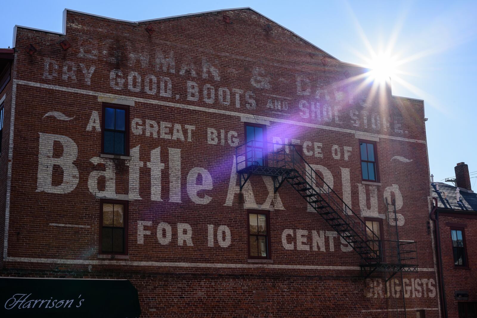 The Battle Ax Plug ghost sign mural on the side of the Harrison's Restaurant building in downtown Tipp City, October 31, 2020. TOM GILLIAM