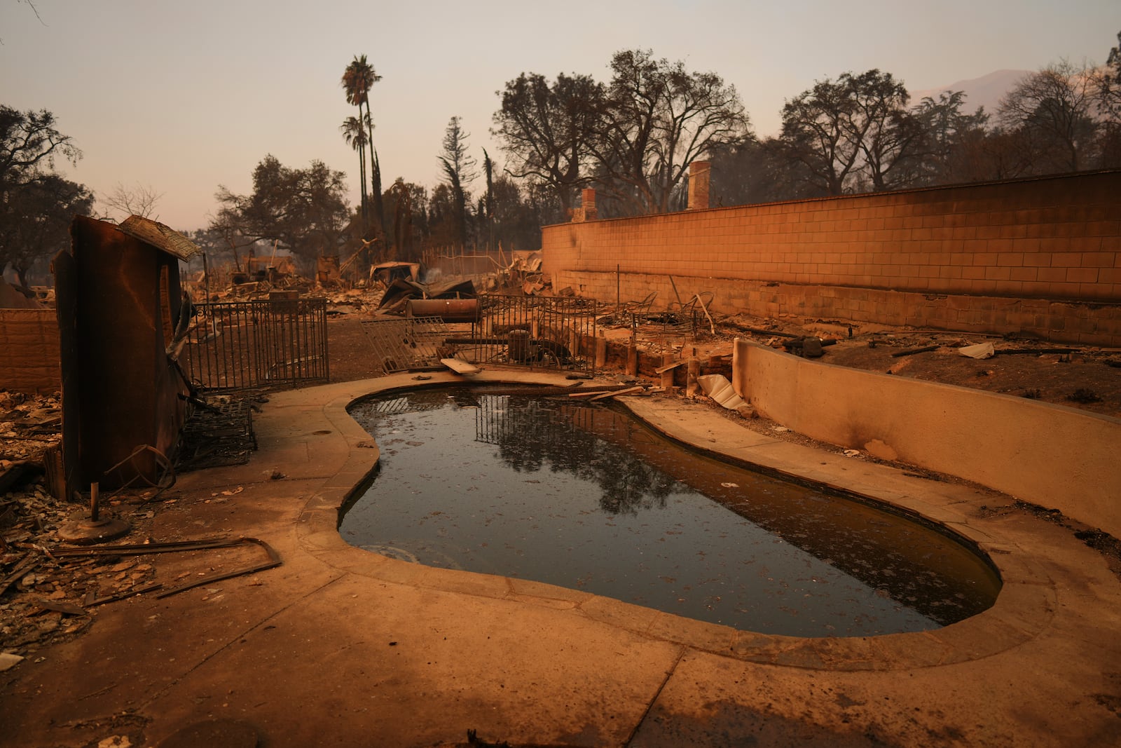 A fire ravaged property is seen in the aftermath of the Eaton Fire Thursday, Jan. 9, 2025 in Altadena, Calif. (AP Photo/Eric Thayer)