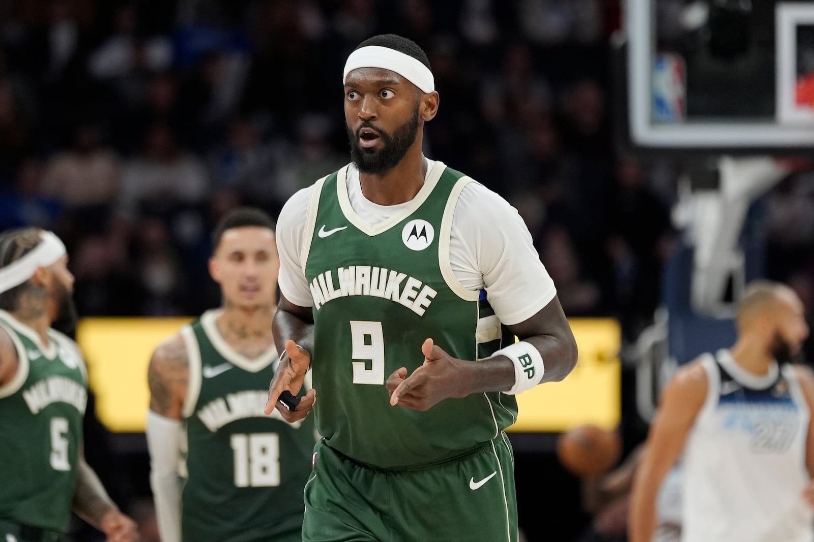 Milwaukee Bucks forward Bobby Portis (9) gestures after making a shot during the second half of an NBA basketball game against the Minnesota Timberwolves, Wednesday, Feb. 12, 2025, in Minneapolis. (AP Photo/Abbie Parr)