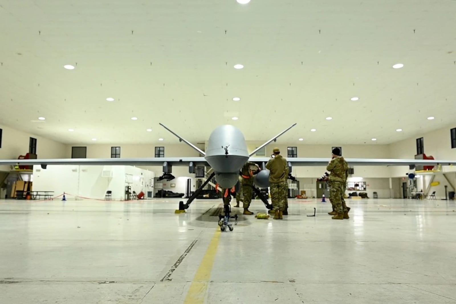 An airman assigned to the Mississippi Air National Guard's 163rd Attack Wing perform post-flight checks on an MQ-9 Reaper Mar. 12, 2024 at the 178th Wing in Springfield, Ohio. This is the first time the remotely-piloted drone has landed at the wing. CONTRIBUTED