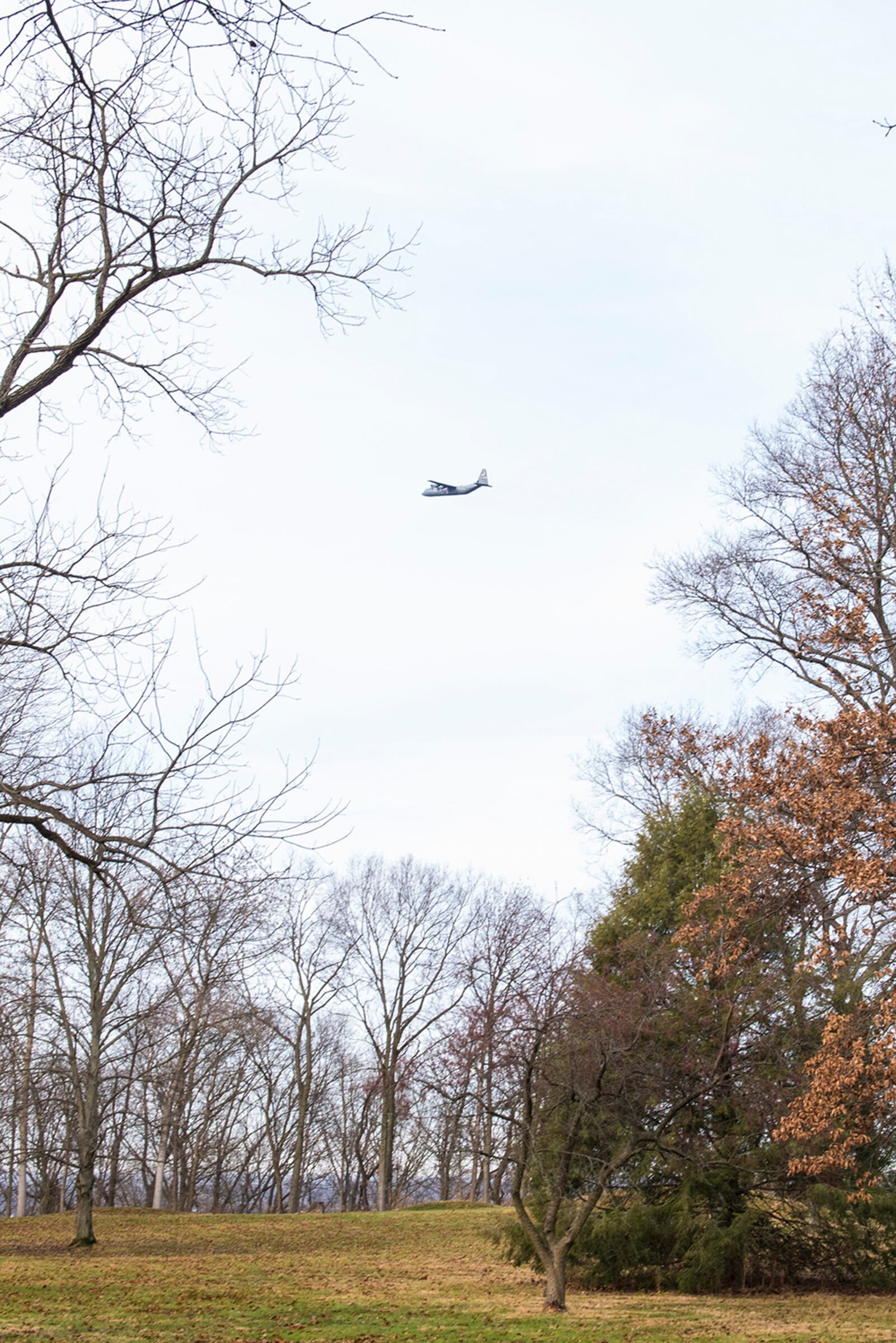 A C-130J Hercules aircraft flies by the Wright Brothers Memorial after the annual First Flight ceremony Dec. 17 at Wright-Patterson Air Force Base. U.S. AIR FORCE PHOTO/JAIMA FOGG