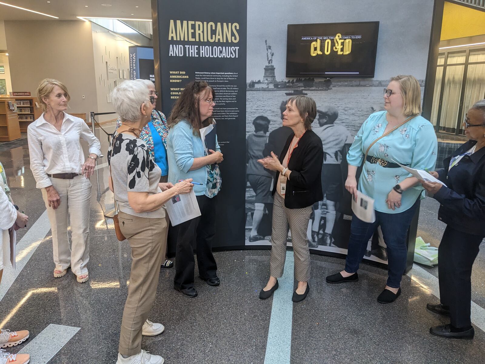 Jayne Klose, (center) Community Engagement Manager at Dayton Metro Library and local Project Manager for the “Americans and the Holocaust” exhibit, is shown training docents at the downtown Dayton Metro Library. CONTRIBUTED