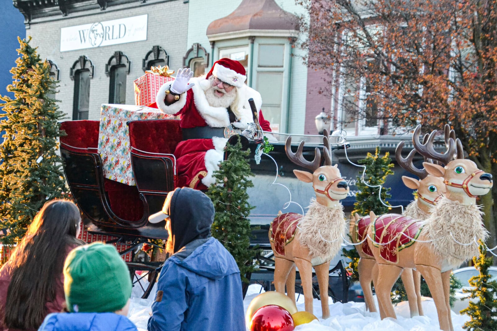 FILE - Santa Claus waves to families from his sleigh during La Porte's Santa Parade on the afternoon of Saturday, Nov. 25, 2023, in La Porte, Ind. (Amanda Haverstick/La Porte County Herald-Dispatch via AP, File)