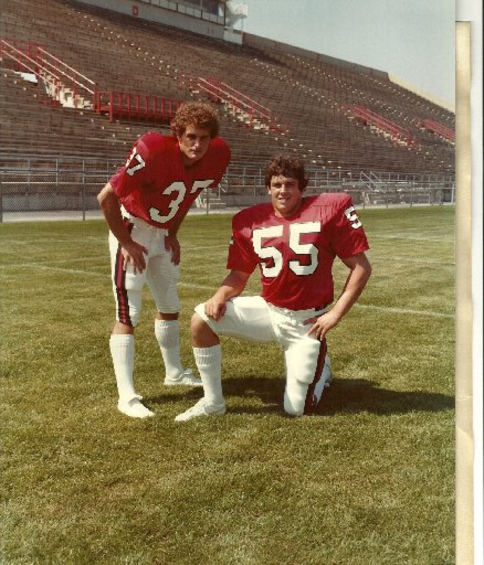 Former Michigan coach Brady Hoke (No. 55) and his brother Jon Hoke (37), an assistant with the Chicago bears, pose during their days playing football for Ball State together.