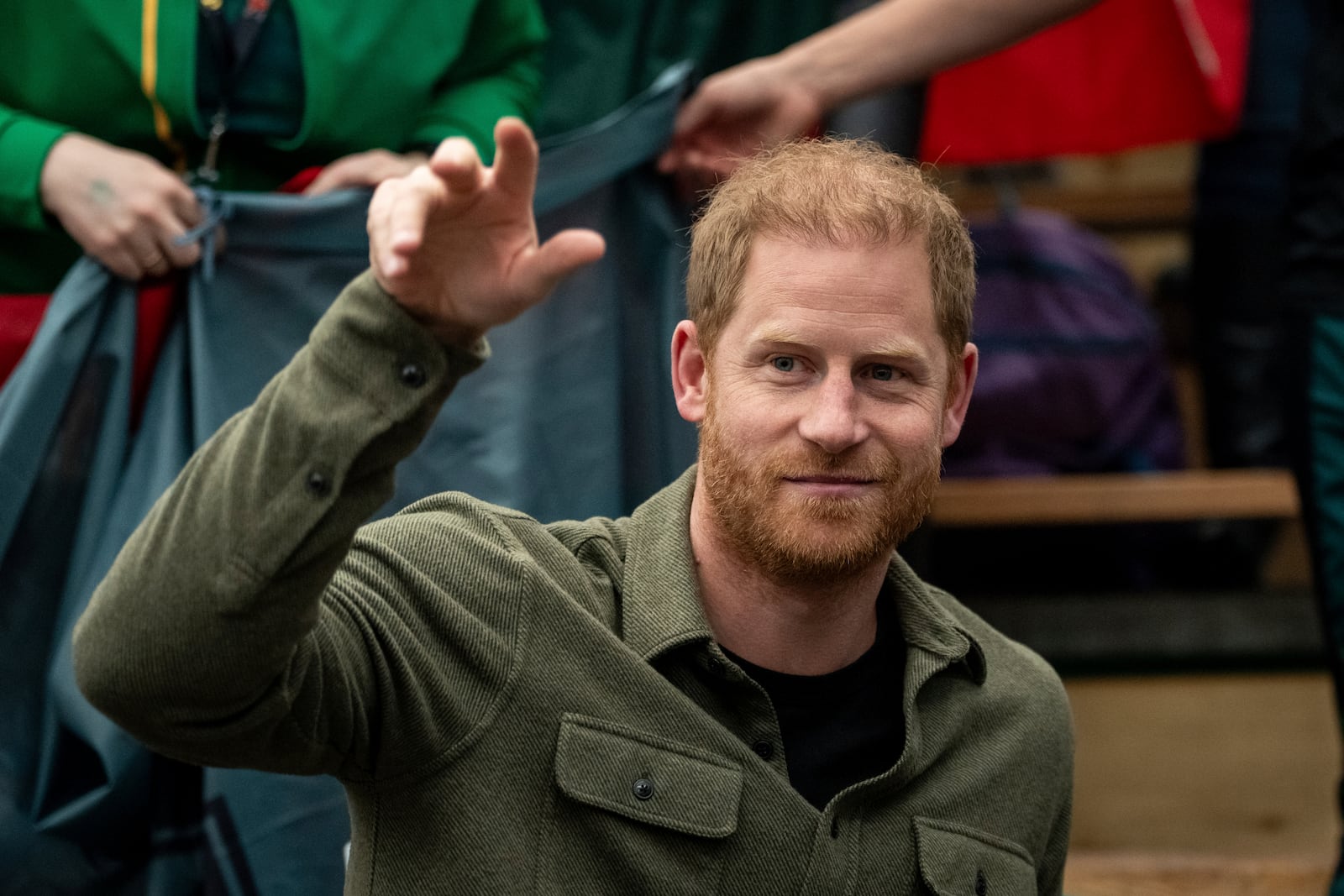 FILE - Prince Harry, the Duke of Sussex, cheers with Team Lithuania during Sitting Volleyball at the 2025 Invictus Games, in Vancouver, on Saturday, Feb. 15, 2025. (Ethan Cairns/The Canadian Press via AP, file)