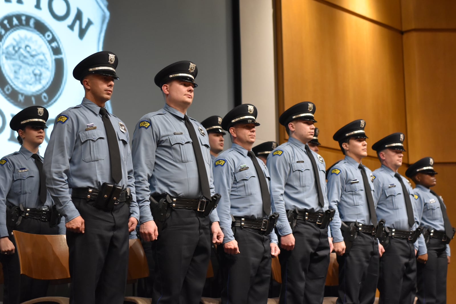 Fifteen members of the 114th Dayton police recruit class graduated on Nov. 17, 2023, at Sinclair Community College. CORNELIUS FROLIK / STAFF